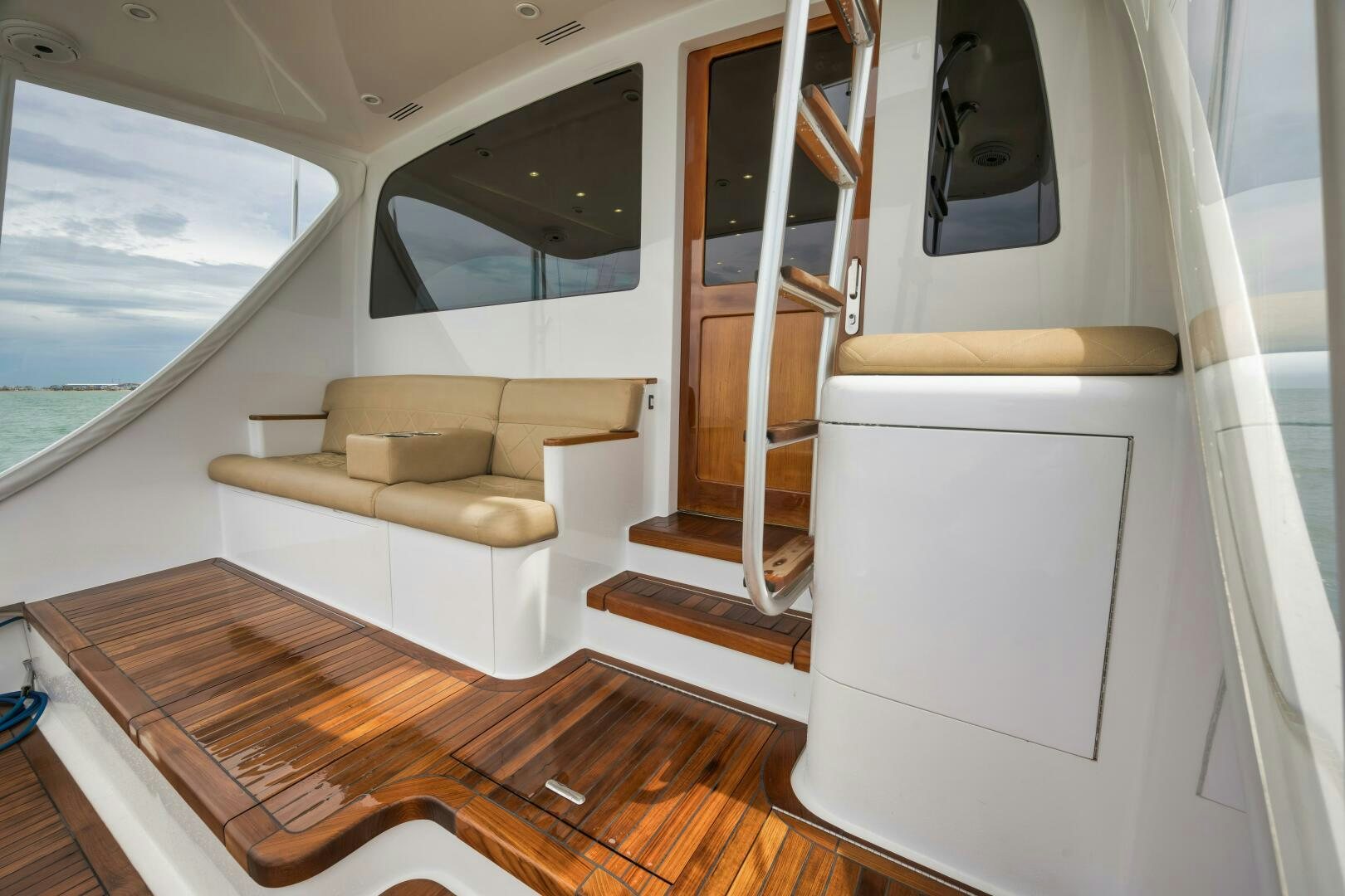 a room with a couch and a tv on the wall aboard LET  RIDE Yacht for Sale