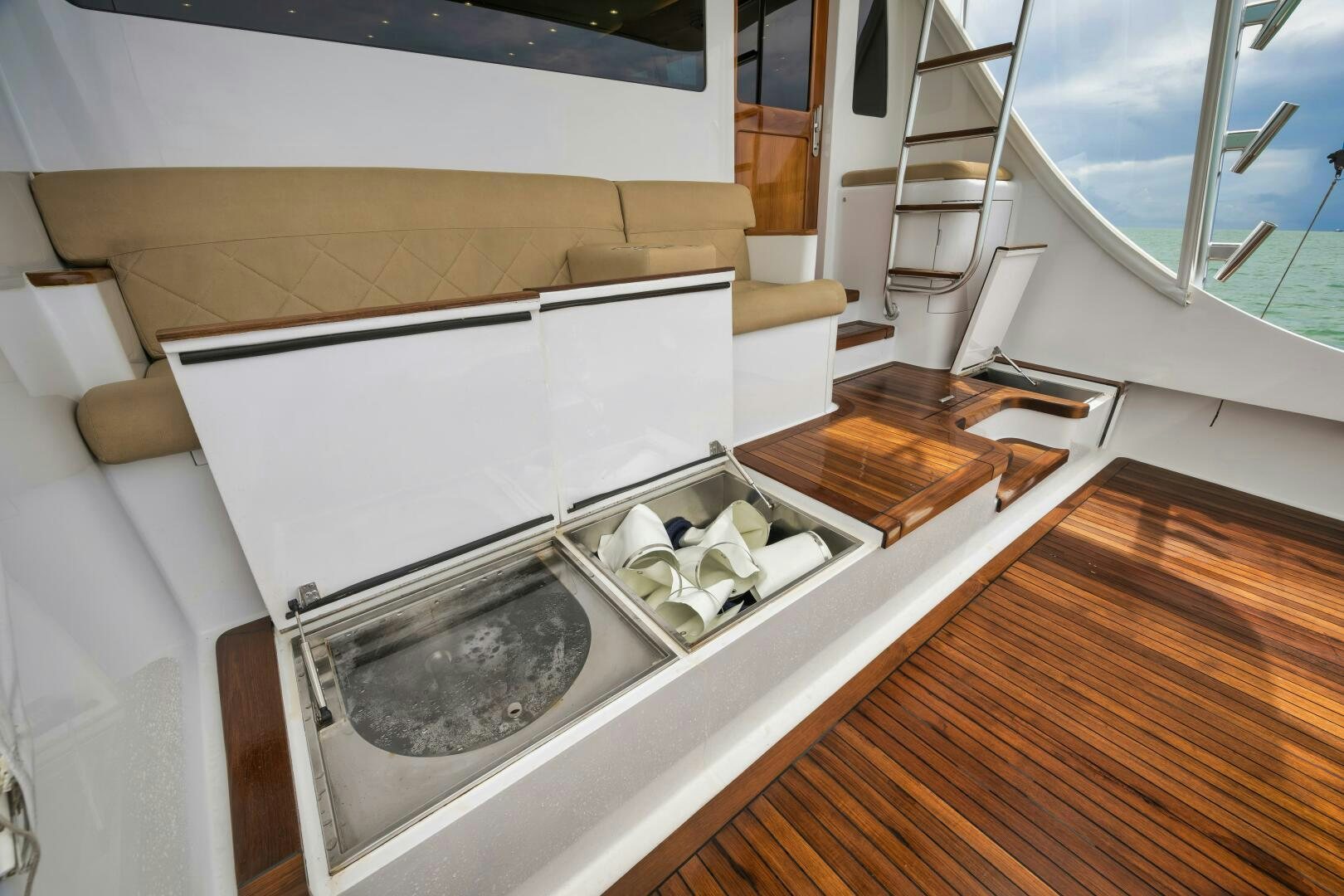 a kitchen with a large window aboard LET  RIDE Yacht for Sale