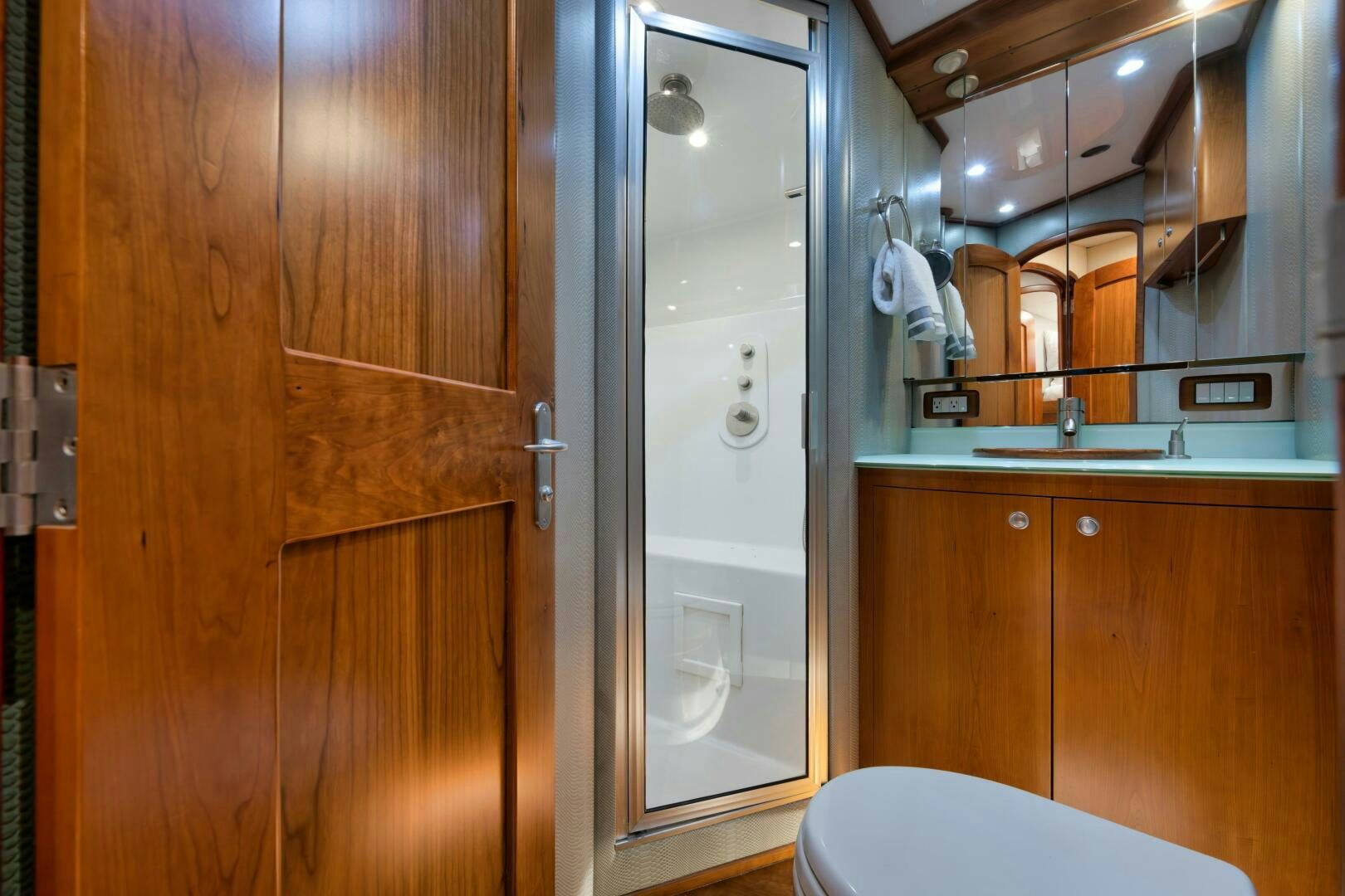 a bathroom with a shower and sink aboard LET  RIDE Yacht for Sale