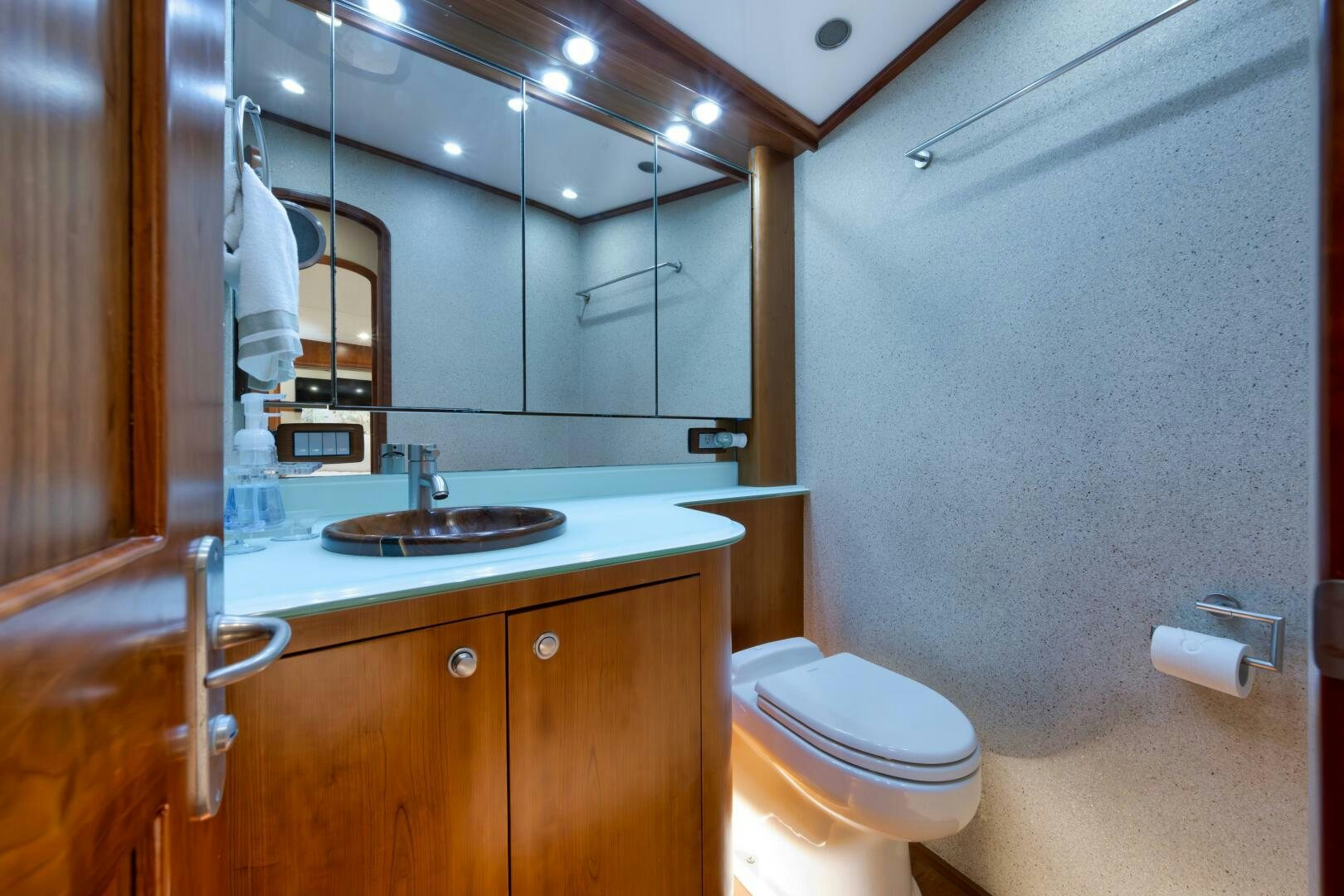 a bathroom with a sink and toilet aboard LET  RIDE Yacht for Sale