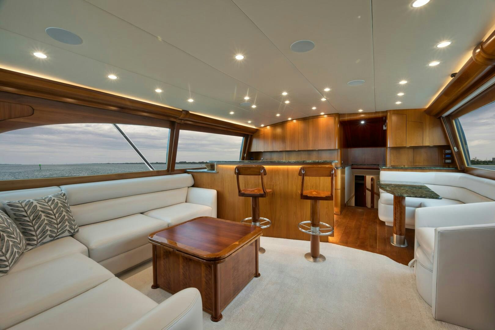 a living room with a couch and a table aboard LET  RIDE Yacht for Sale