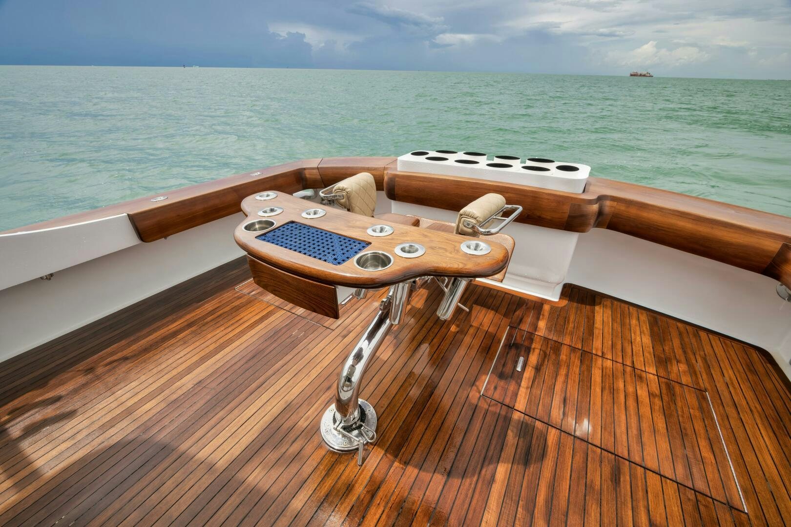a wood table on a boat aboard LET  RIDE Yacht for Sale