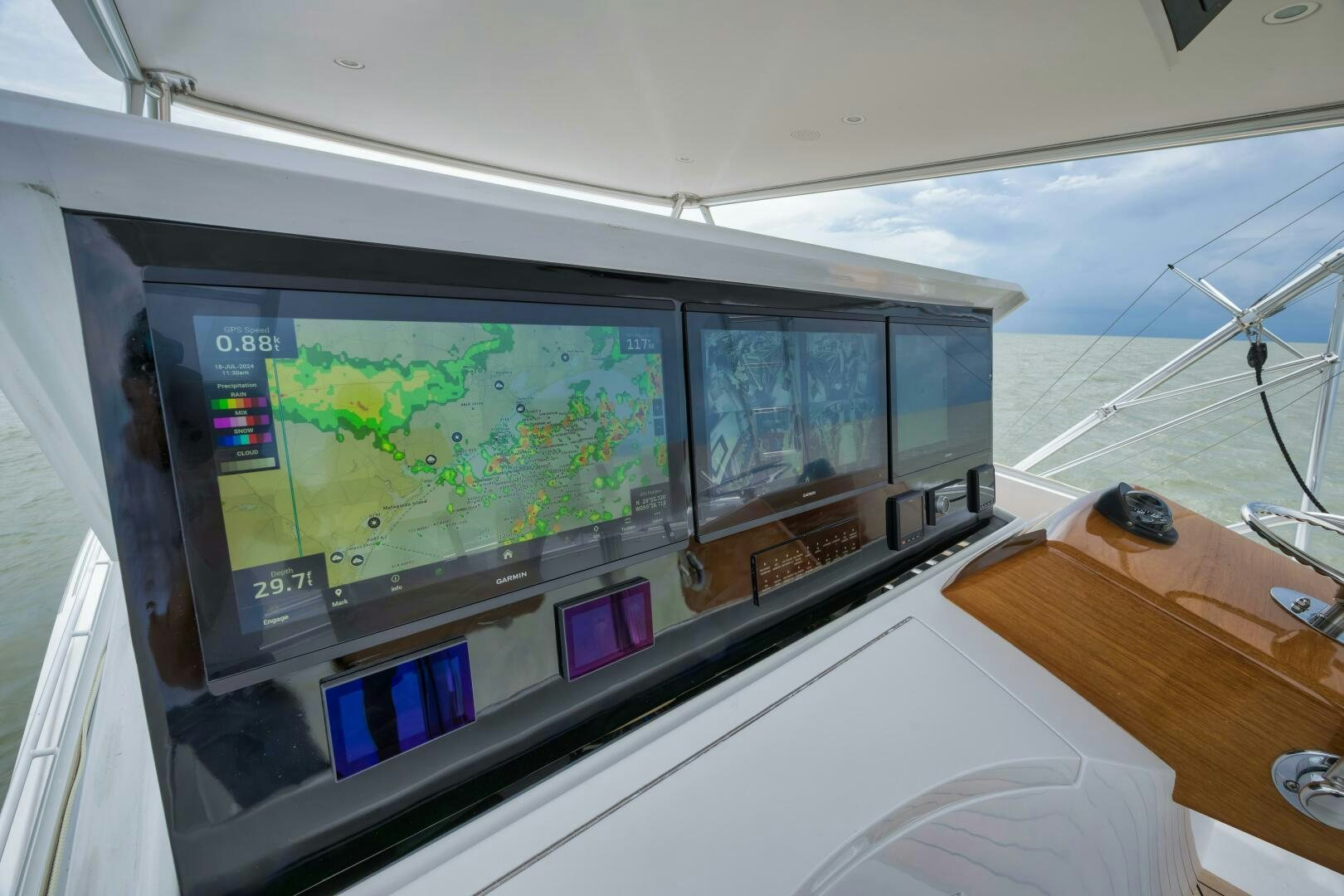 a large television screen aboard LET  RIDE Yacht for Sale