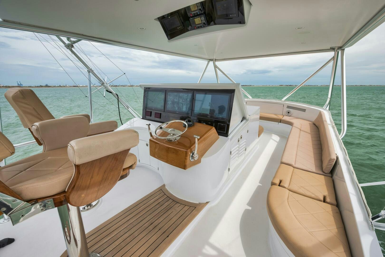 a boat with a laptop on the deck aboard LET  RIDE Yacht for Sale
