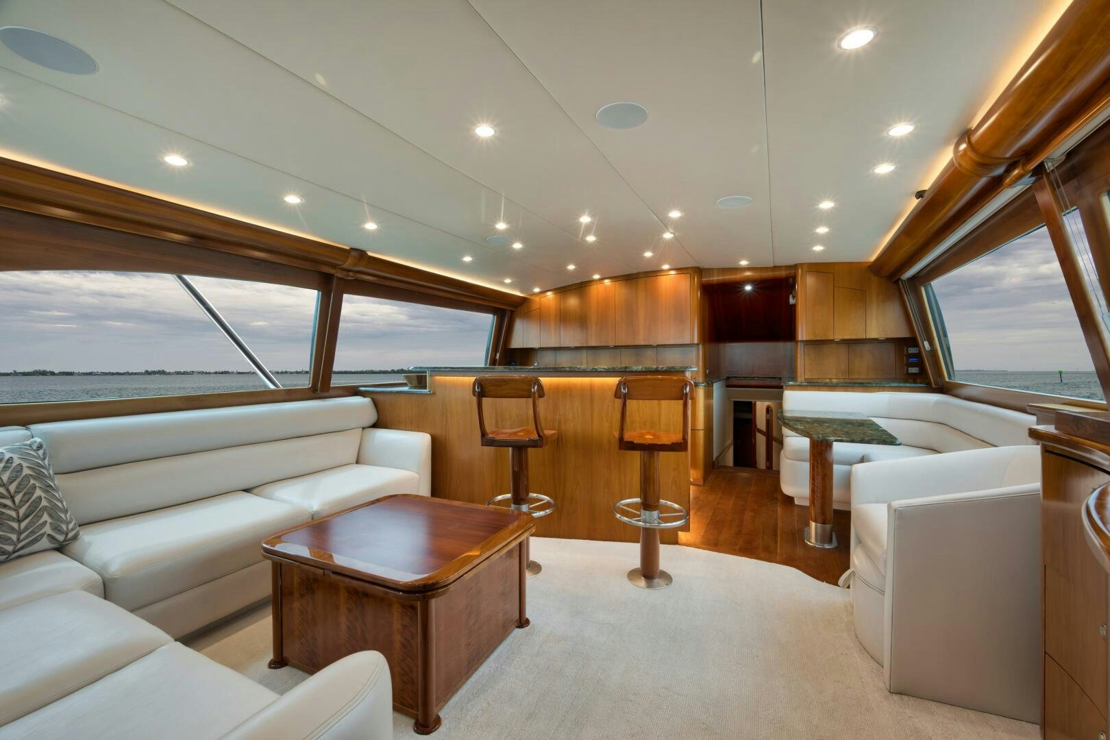 a room with a couch and a table aboard LET  RIDE Yacht for Sale