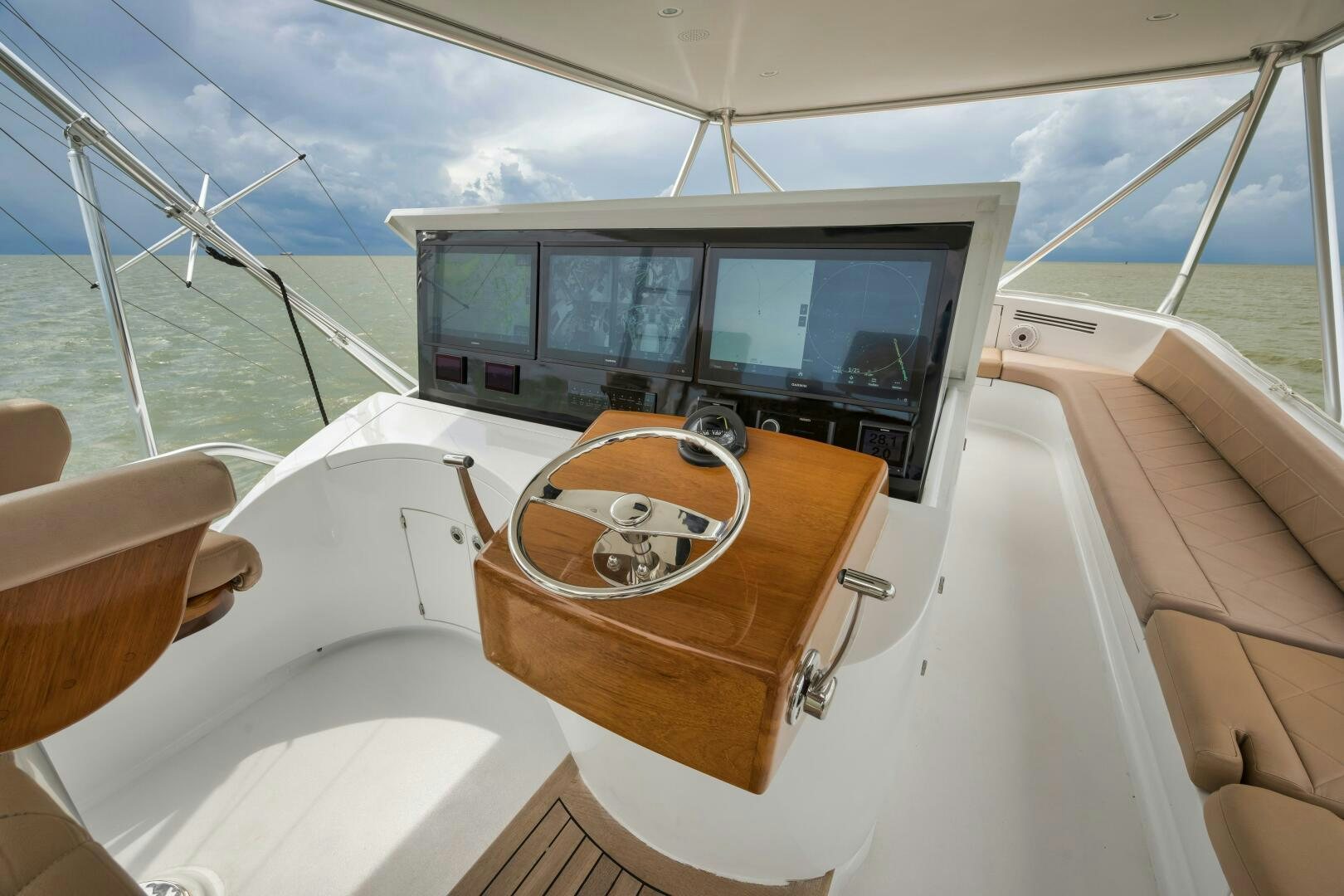 a boat with a seat and a steering wheel on the front aboard LET  RIDE Yacht for Sale