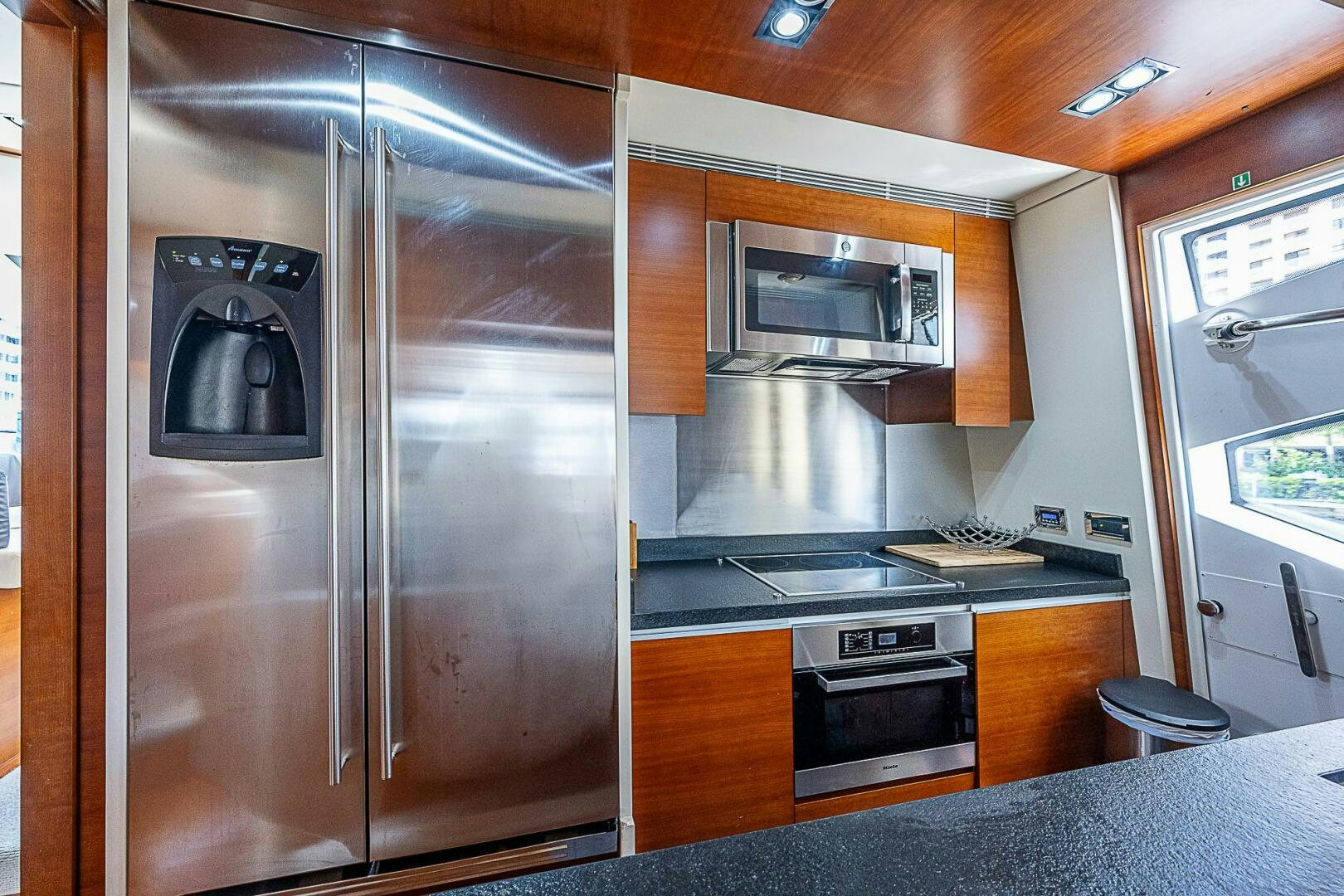 a kitchen with stainless steel appliances aboard LADY MARIE-CLAIRE Yacht for Sale