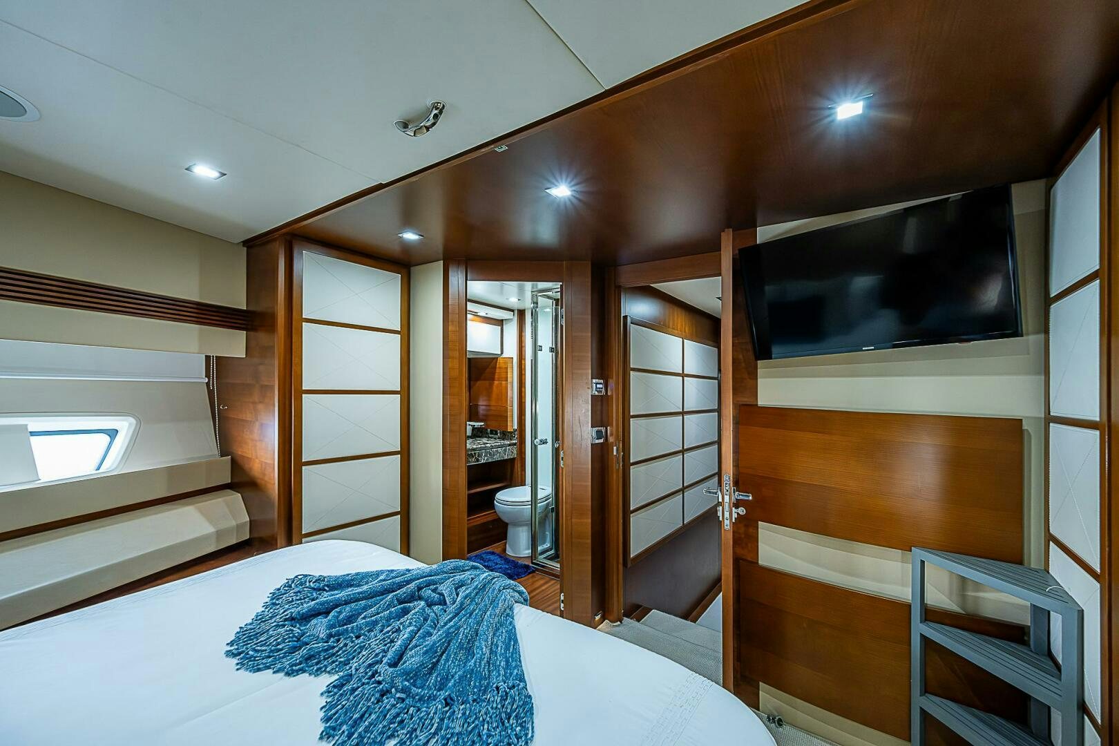 a bedroom with a bed and a television aboard LADY MARIE-CLAIRE Yacht for Sale