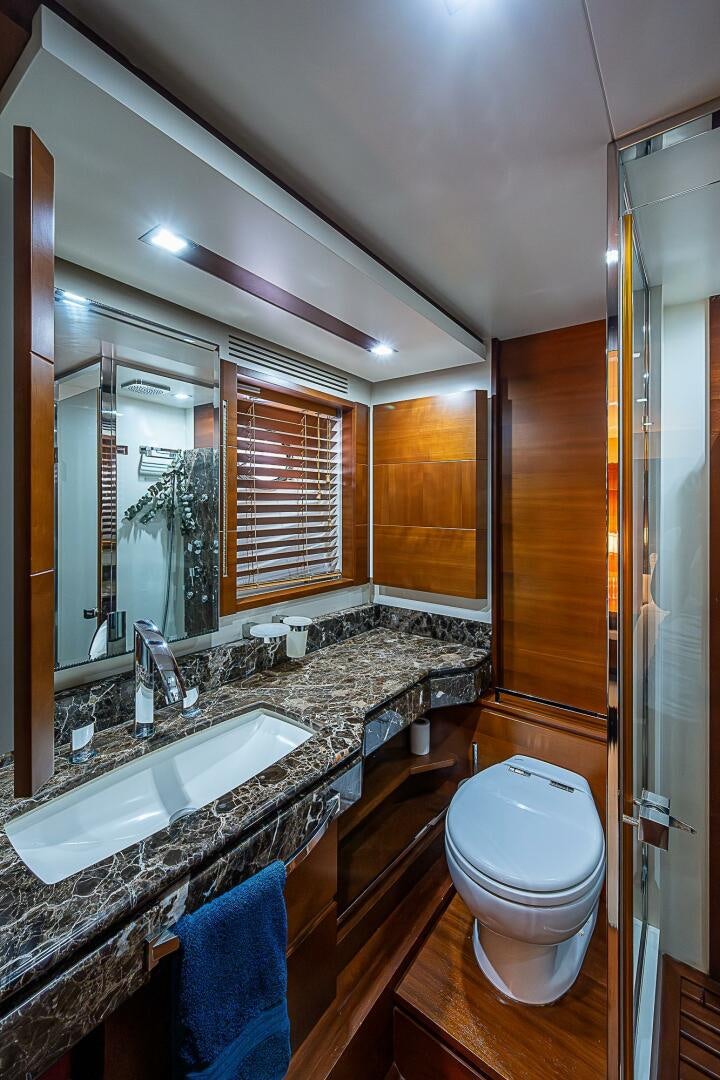 a bathroom with a large mirror aboard LADY MARIE-CLAIRE Yacht for Sale