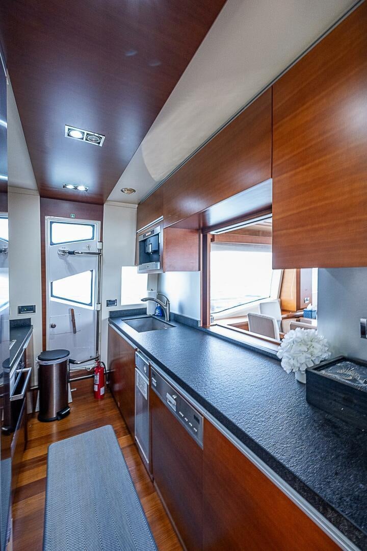 a kitchen with a large island aboard LADY MARIE-CLAIRE Yacht for Sale