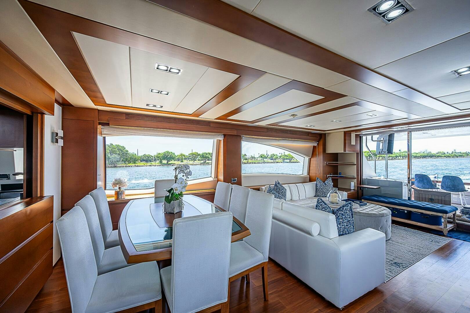 a living room with a table and chairs aboard LADY MARIE-CLAIRE Yacht for Sale