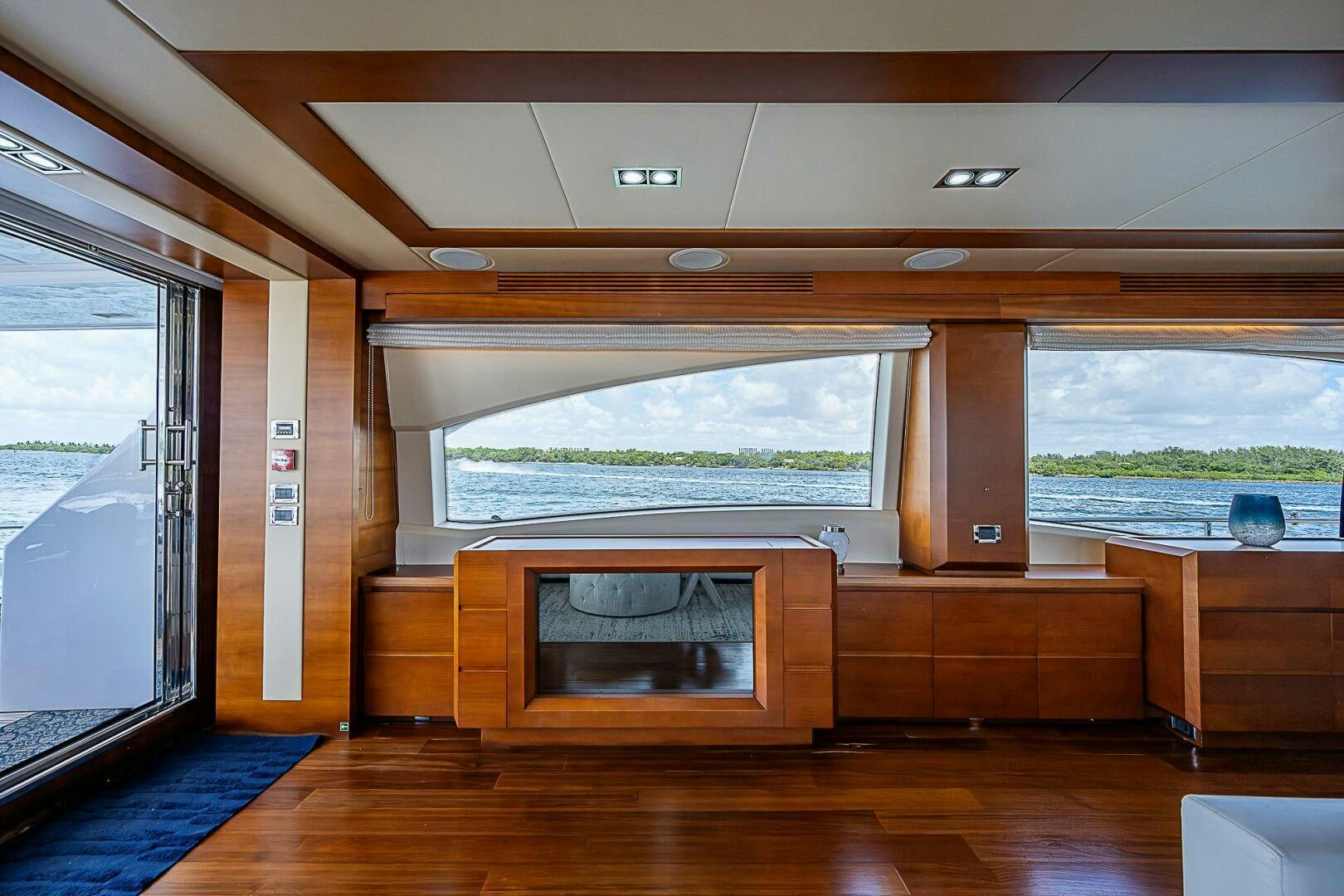 a room with a fireplace and a large window aboard LADY MARIE-CLAIRE Yacht for Sale
