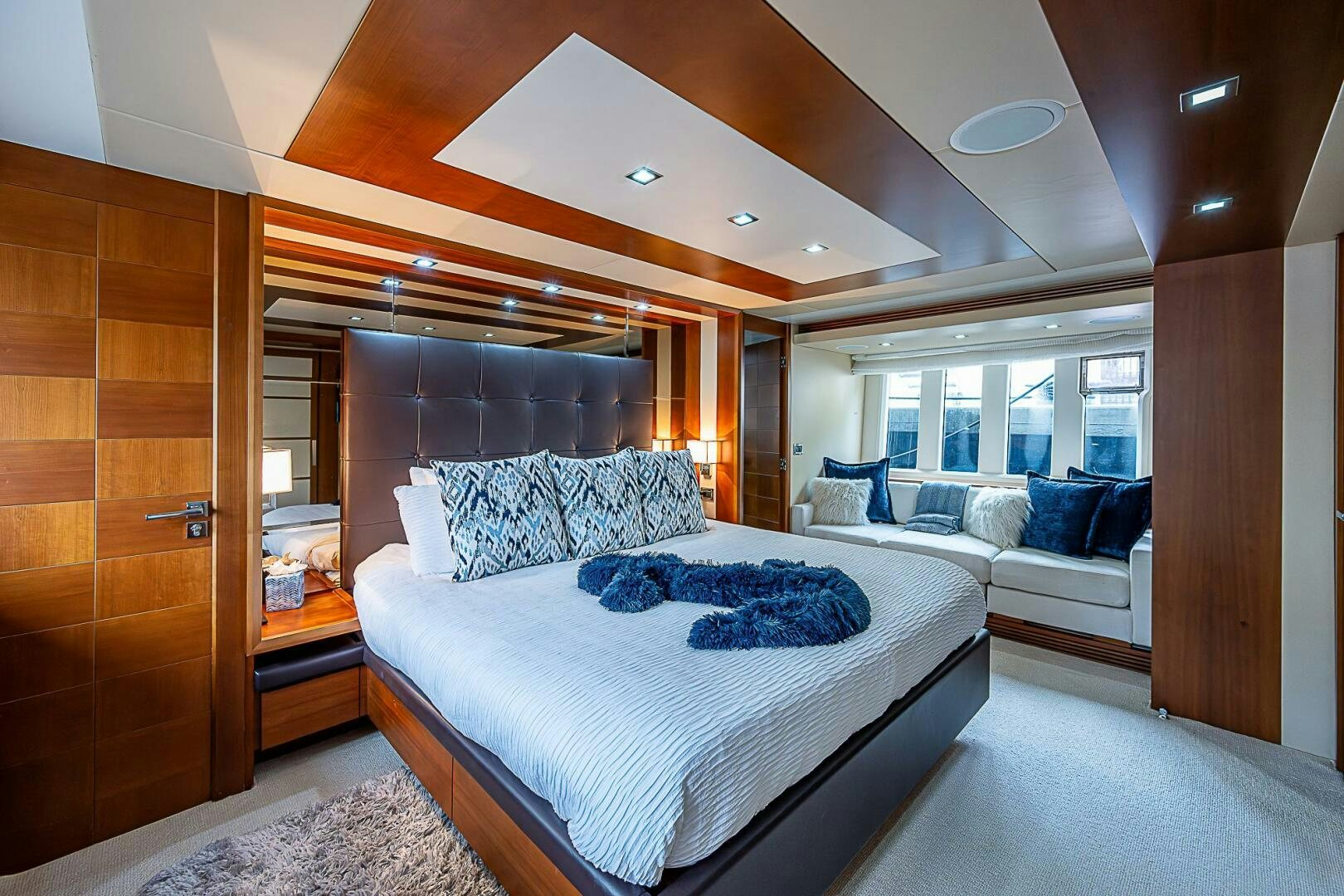 a room with a bed and a desk aboard LADY MARIE-CLAIRE Yacht for Sale