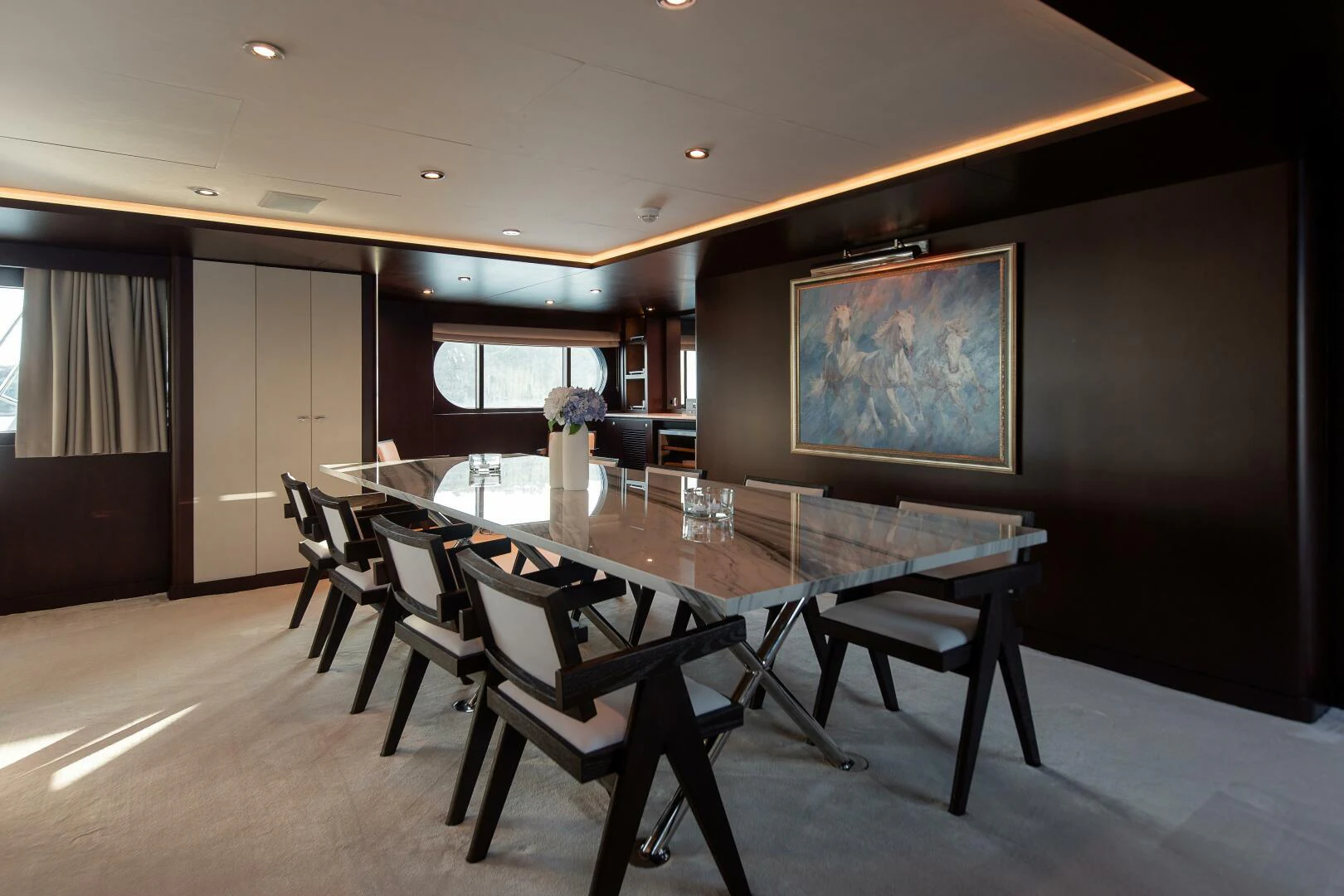 a dining room with a table and chairs aboard AZTECA Yacht for Sale
