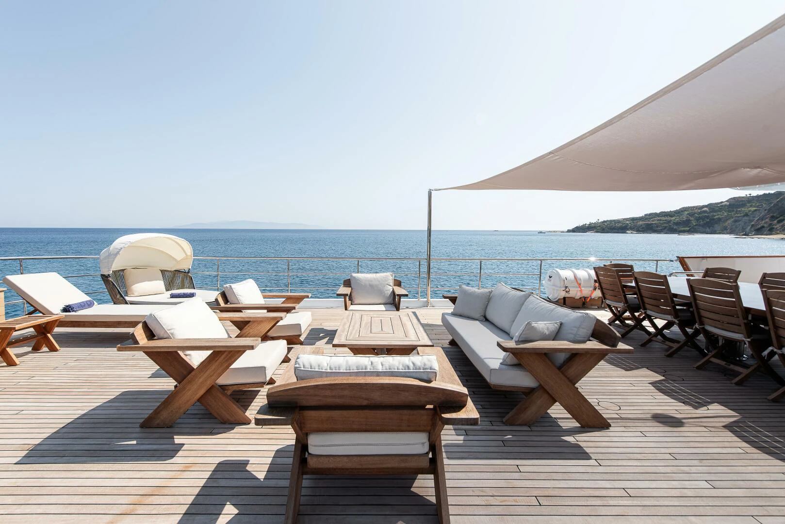 a patio with chairs and tables aboard AZTECA Yacht for Sale