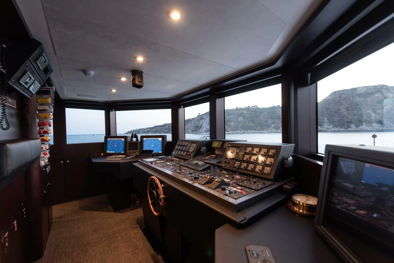 a room with computers and monitors aboard AZTECA Yacht for Sale