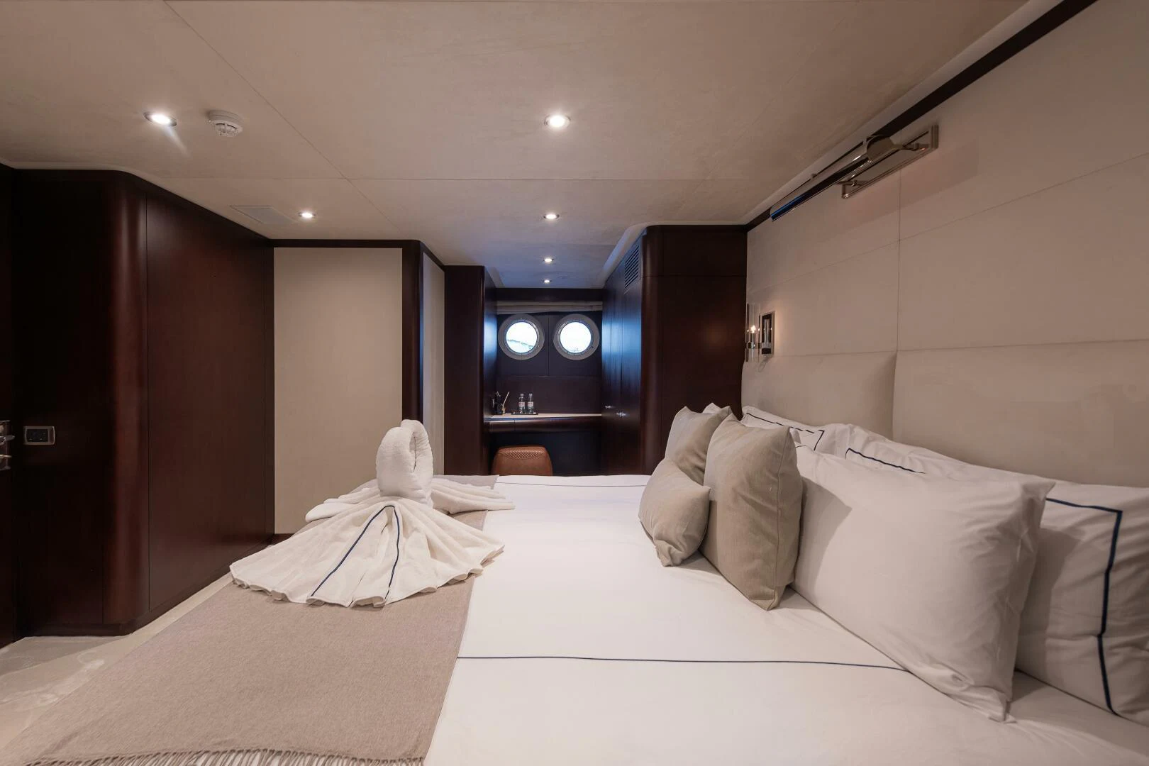 a room with a bed and a fireplace aboard AZTECA Yacht for Sale