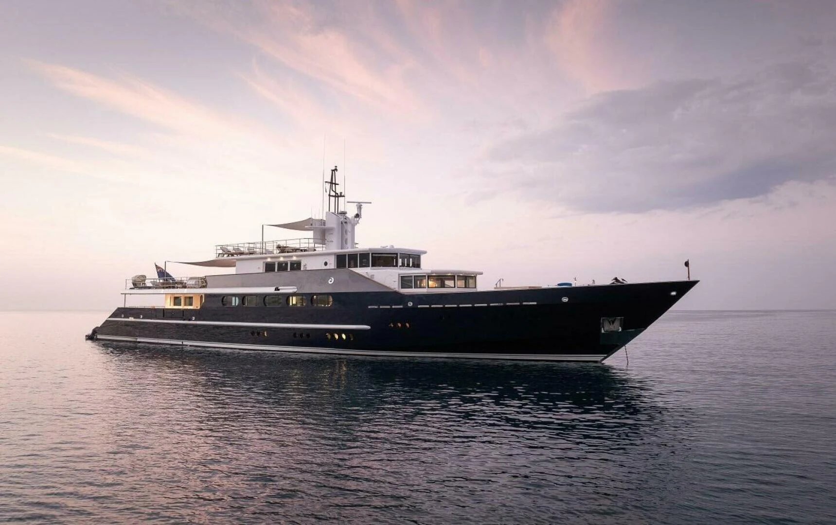 a large ship in the water aboard AZTECA Yacht for Sale