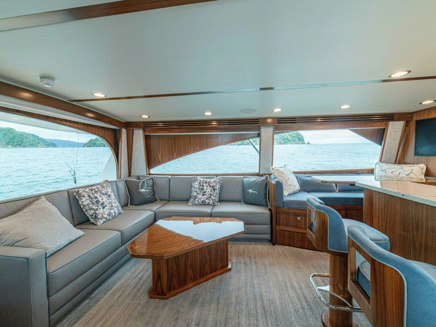 a living room with a couch and a table aboard PURA VIDA Yacht for Sale