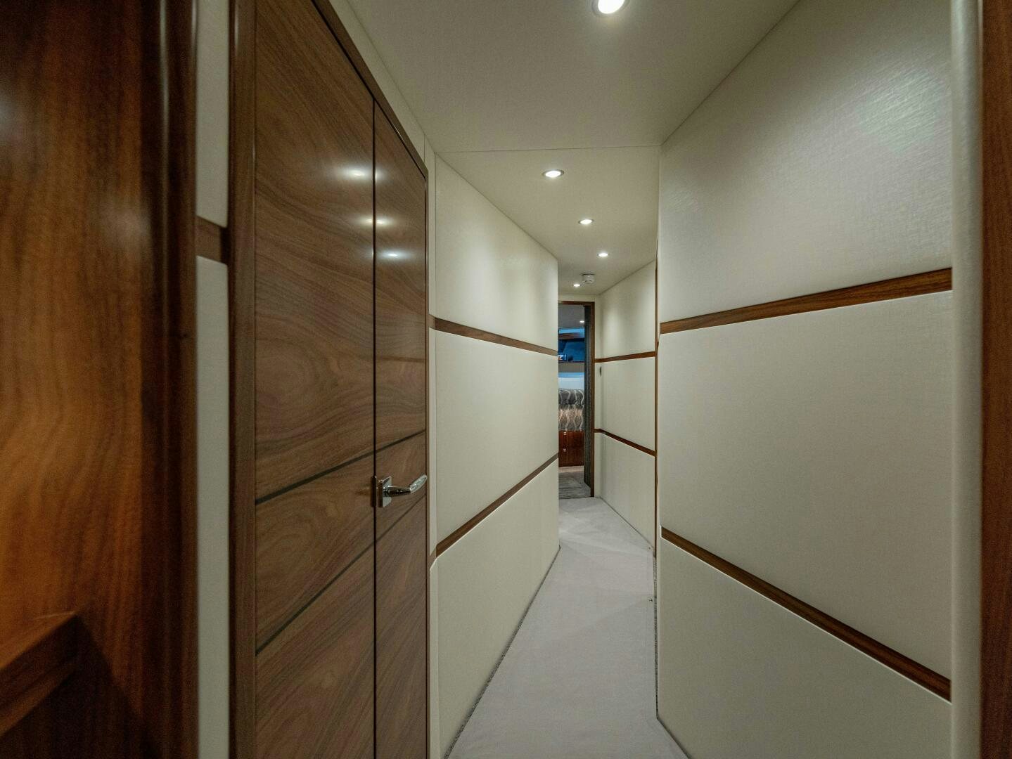 a hallway with doors aboard PURA VIDA Yacht for Sale