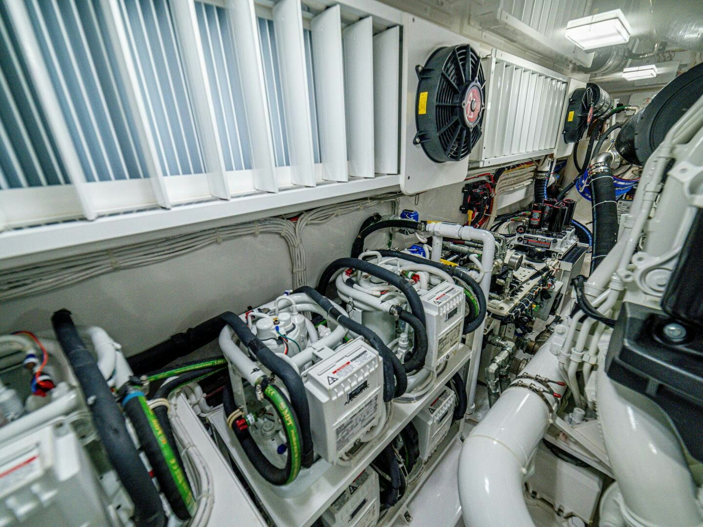a room with several pipes and machinery aboard PURA VIDA Yacht for Sale