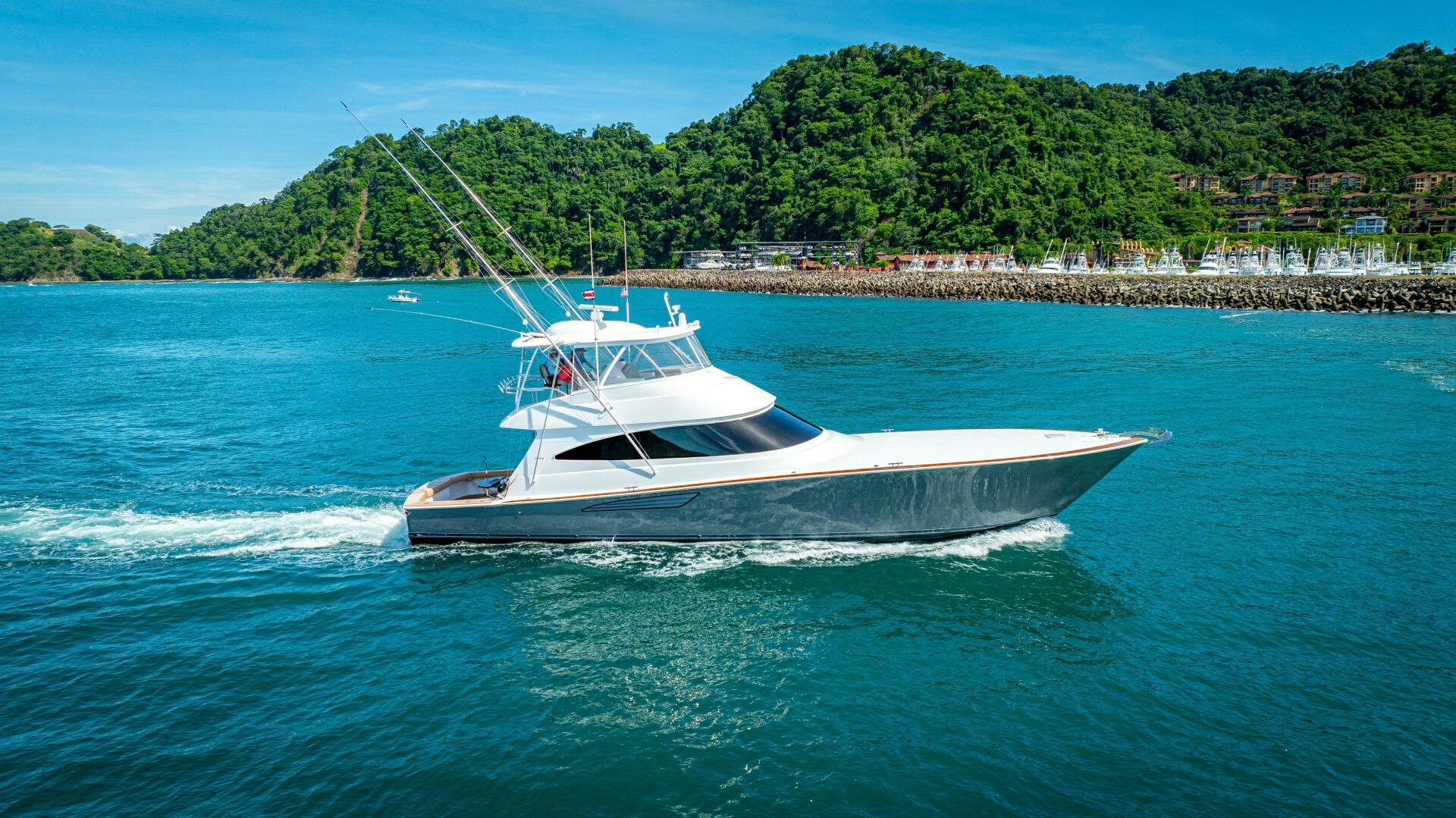 a white boat on the water aboard PURA VIDA Yacht for Sale