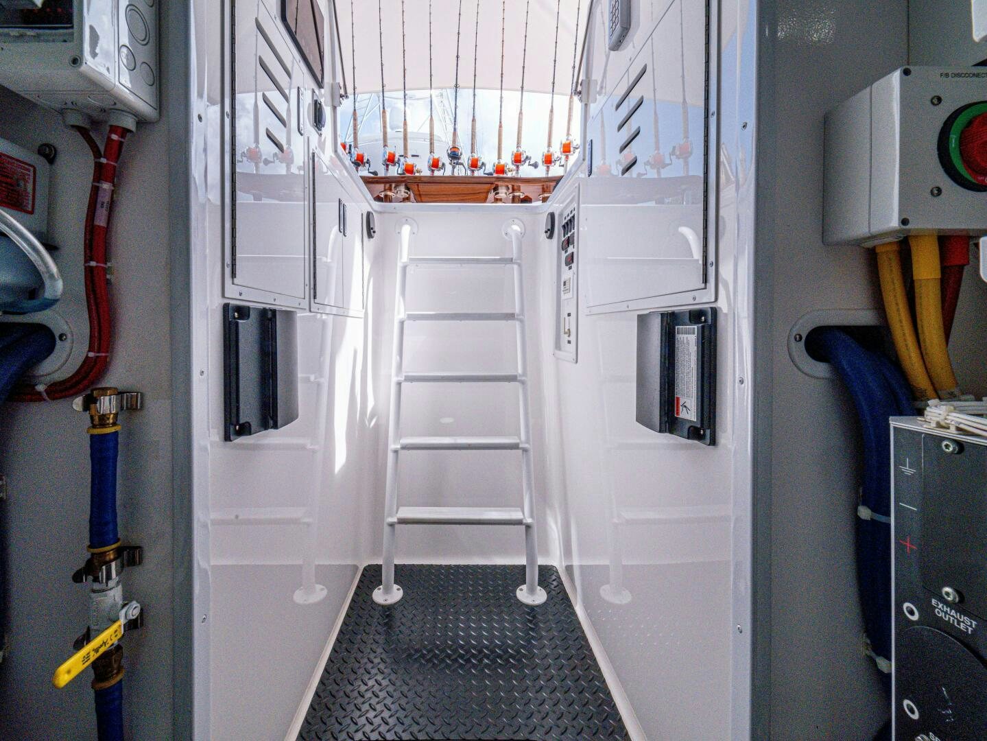 a room with a ladder and equipment aboard PURA VIDA Yacht for Sale