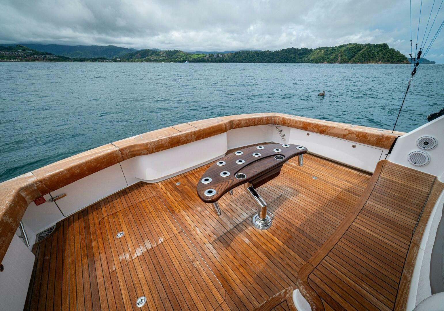 a wooden boat on a body of water aboard PURA VIDA Yacht for Sale