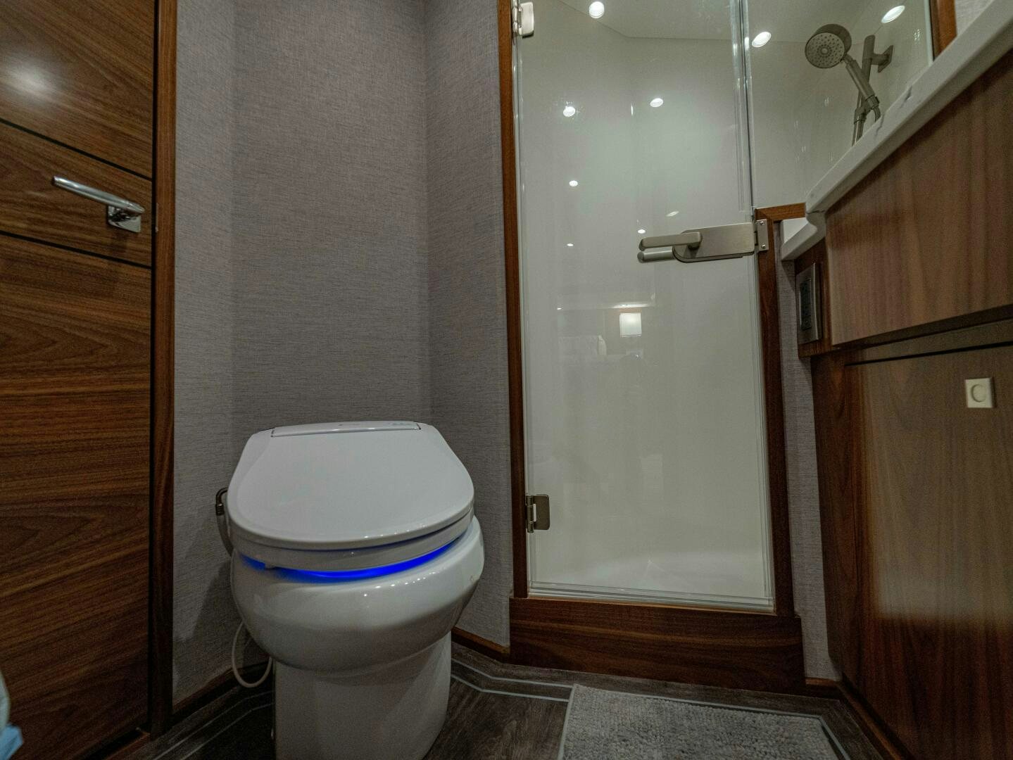 a bathroom with a toilet and a shower aboard PURA VIDA Yacht for Sale