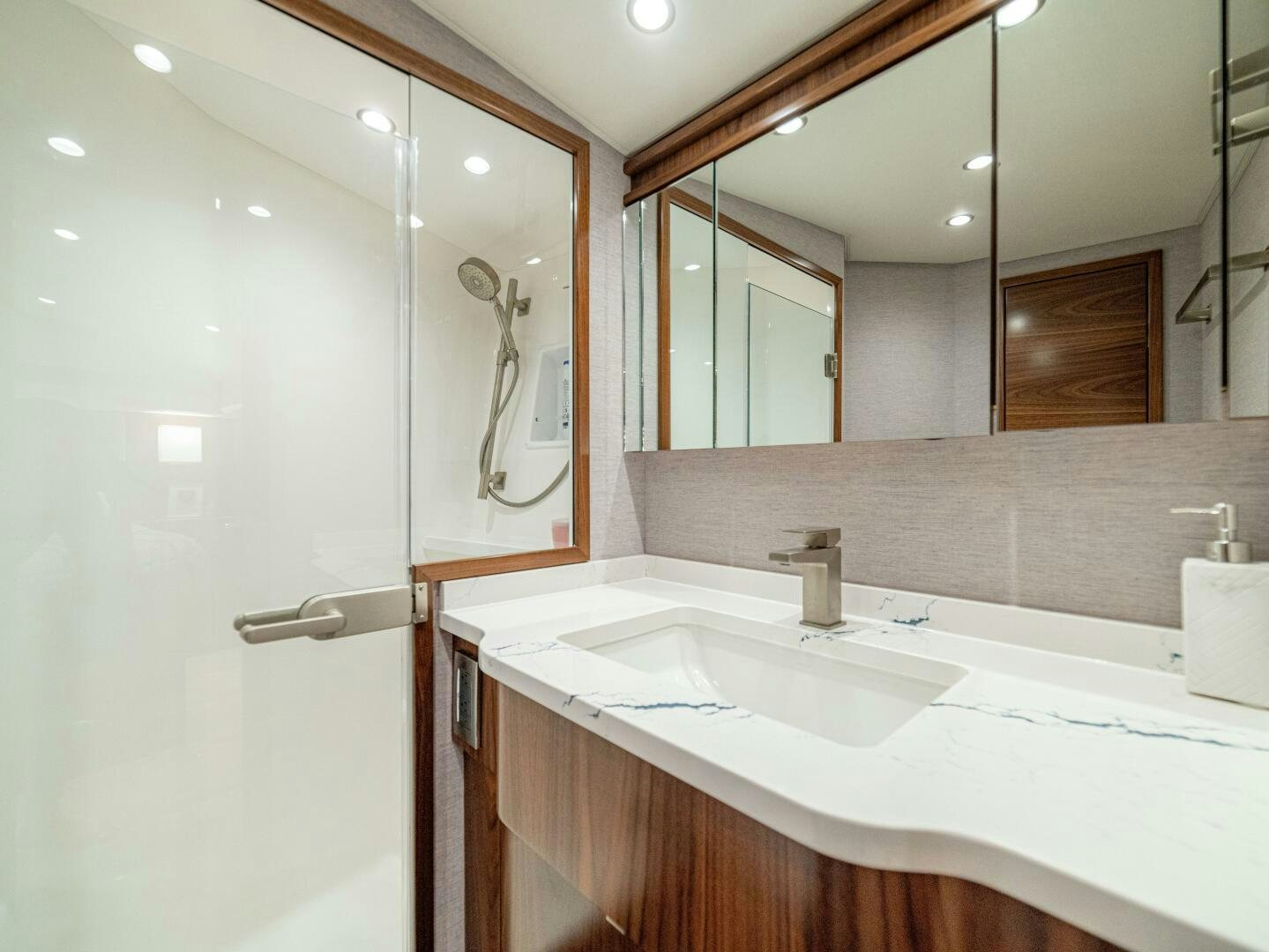 a bathroom with two sinks aboard PURA VIDA Yacht for Sale
