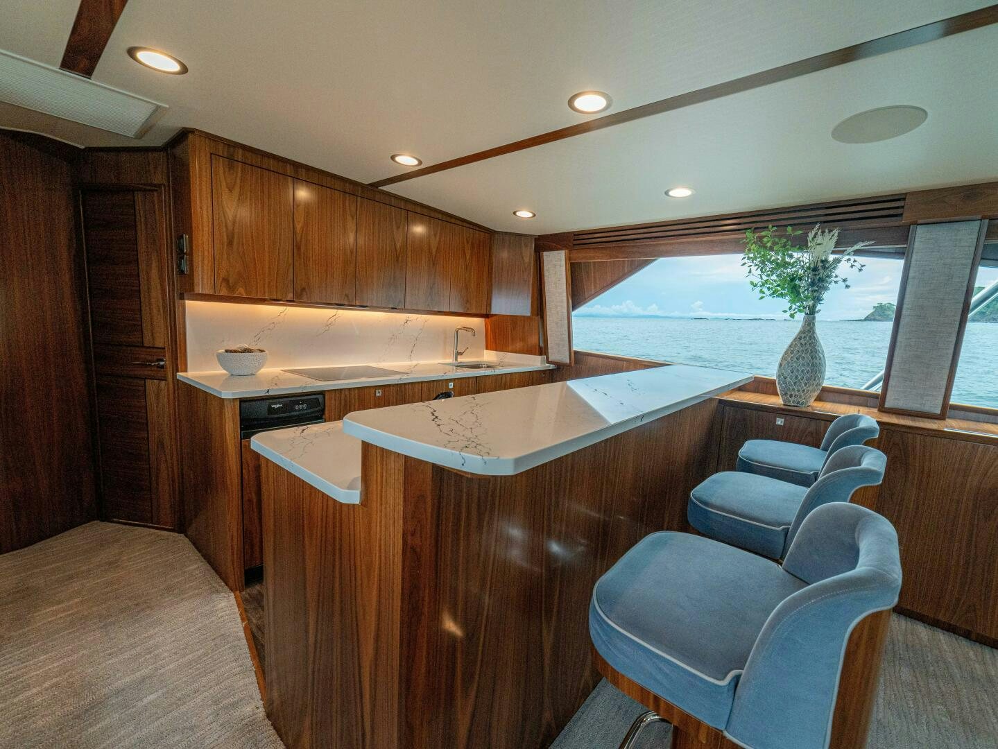 a kitchen with a large island aboard PURA VIDA Yacht for Sale