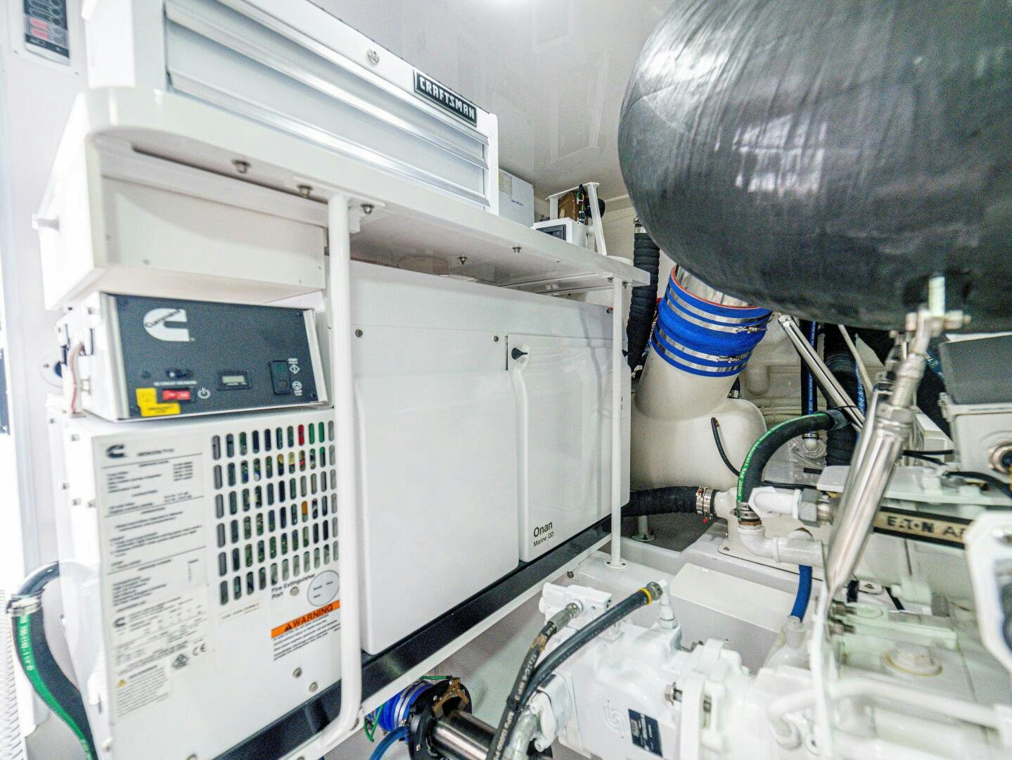 a white machine with a blue and white object on it aboard PURA VIDA Yacht for Sale