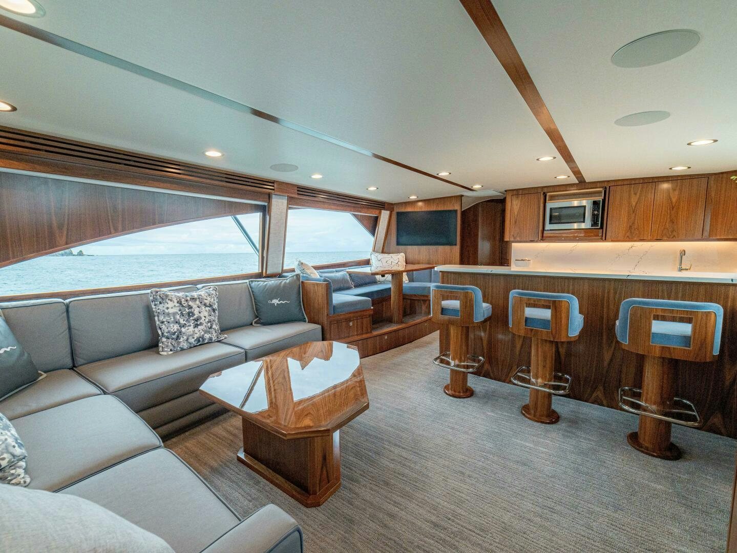 a living room with a large window aboard PURA VIDA Yacht for Sale