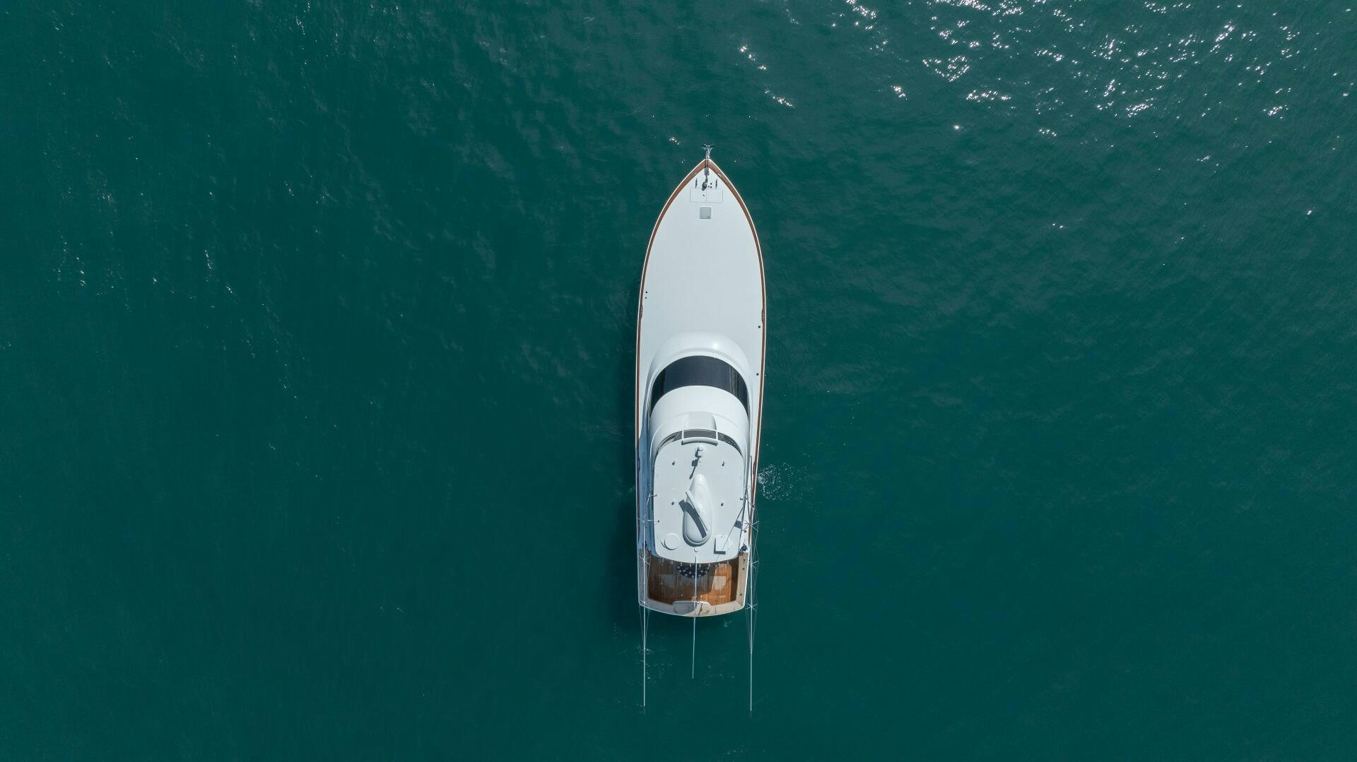 a white boat in the water aboard PURA VIDA Yacht for Sale