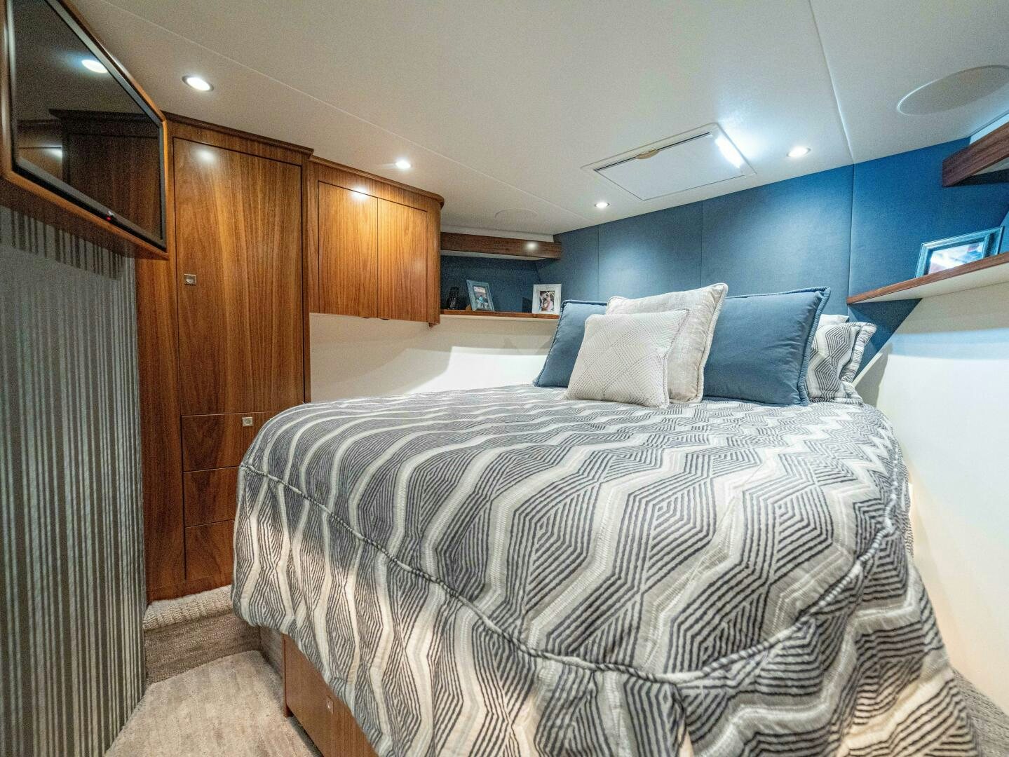 a bed with a white sheet aboard PURA VIDA Yacht for Sale