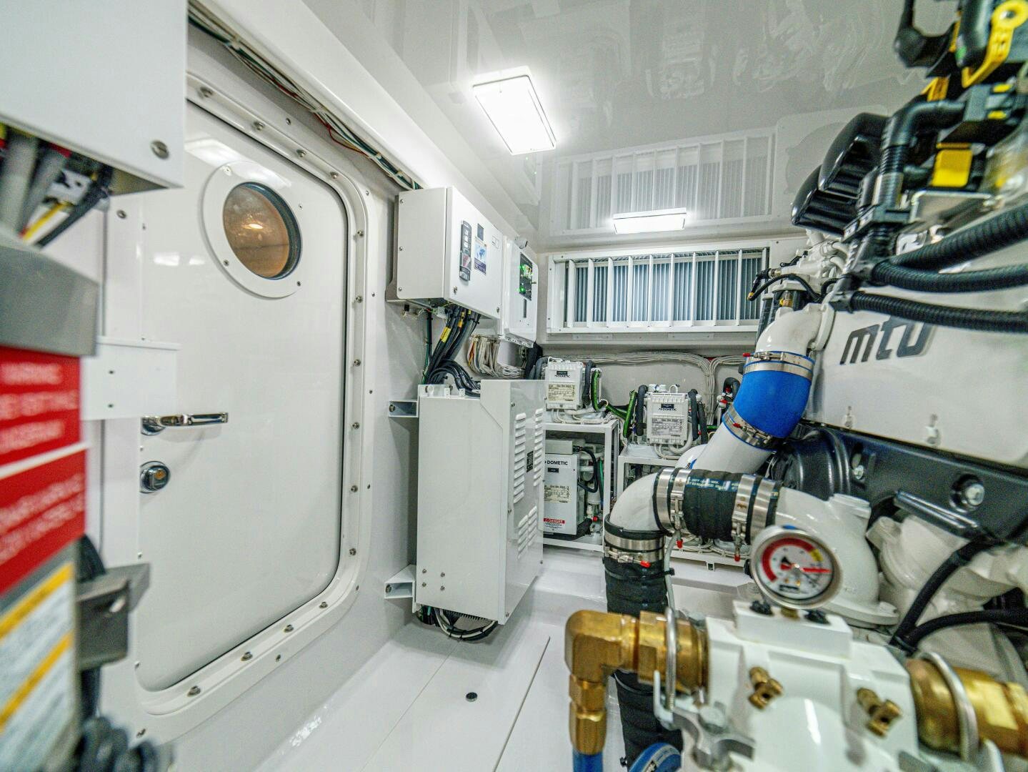 a room with machinery aboard PURA VIDA Yacht for Sale