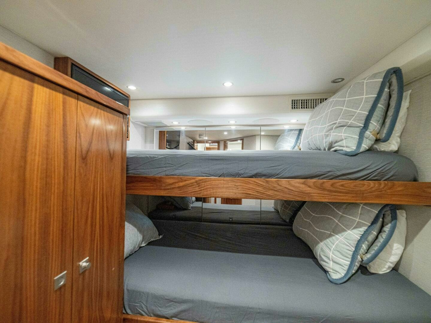 a room with bunk beds aboard PURA VIDA Yacht for Sale