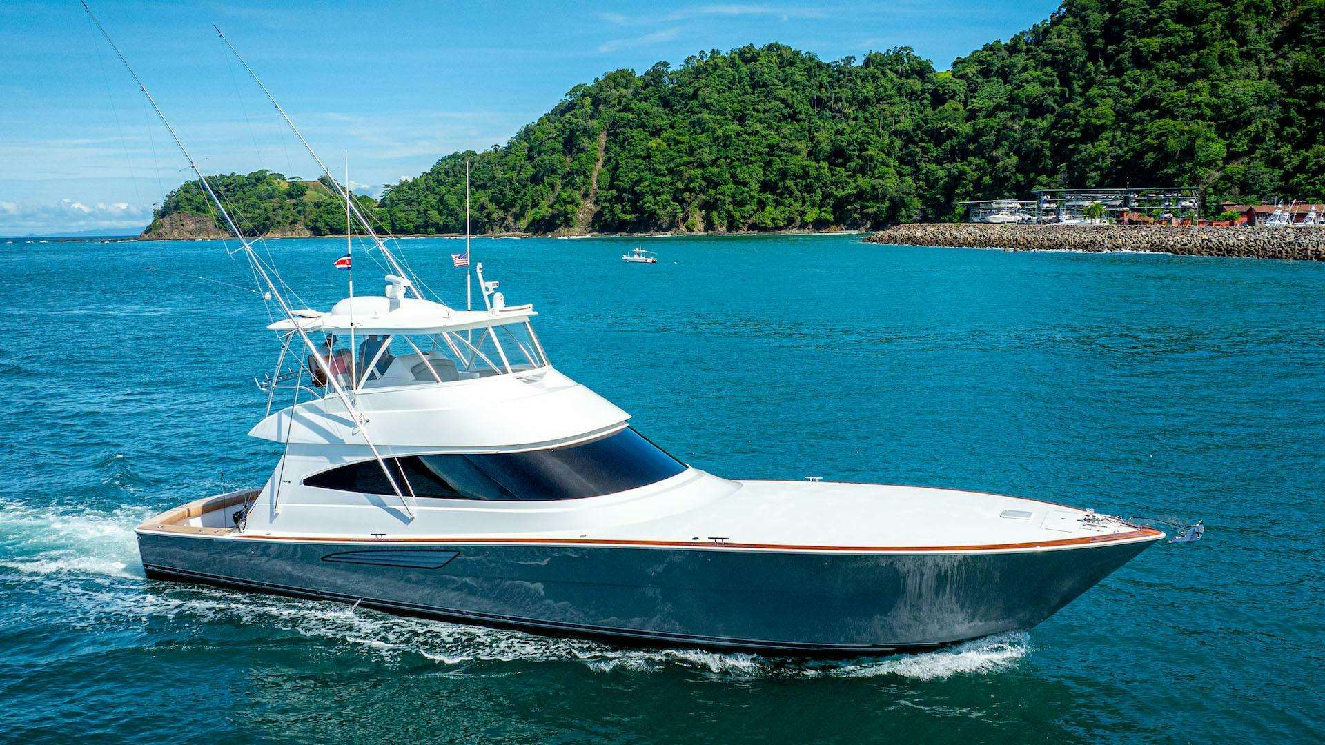 a white boat on the water aboard PURA VIDA Yacht for Sale