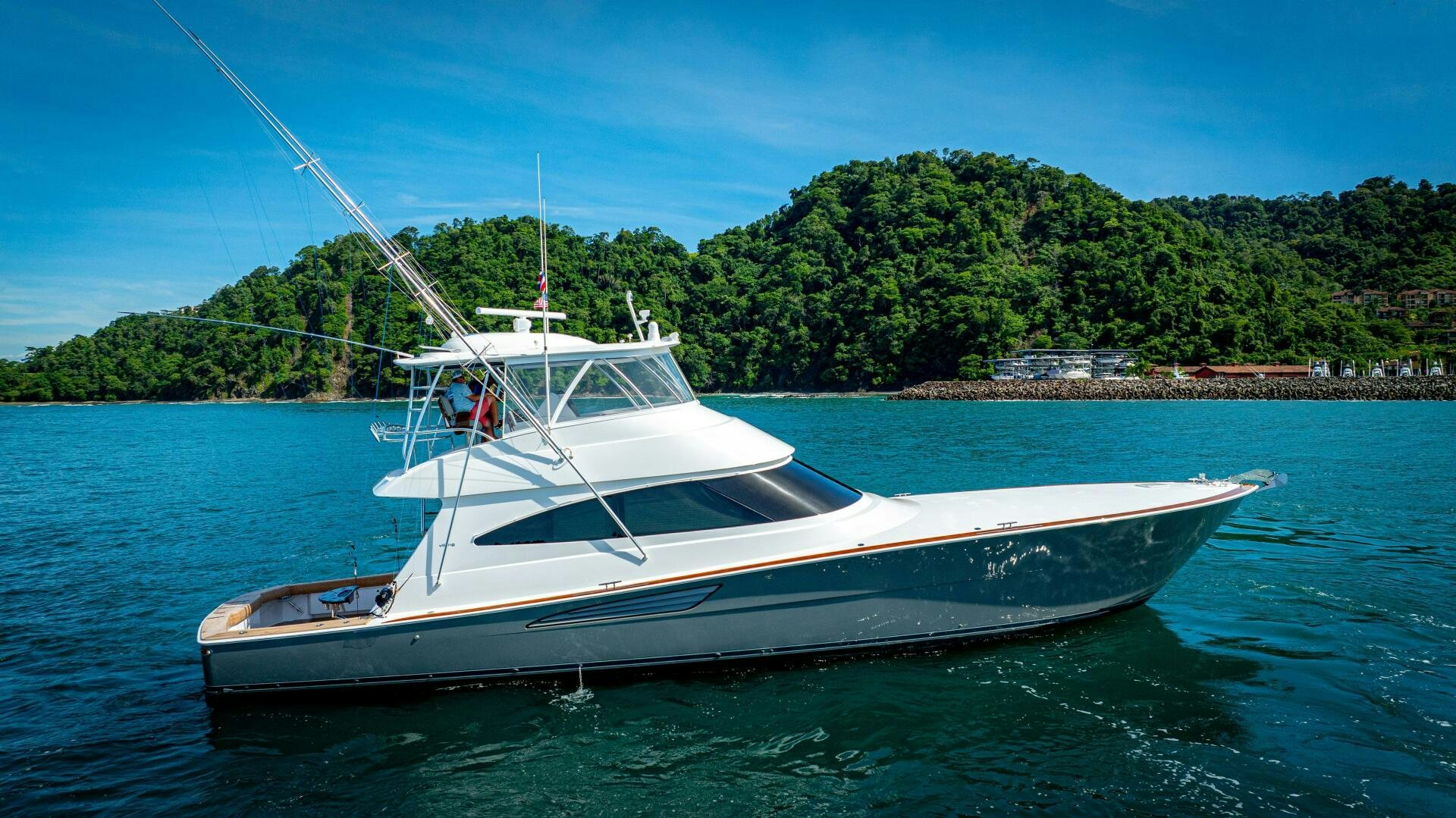 a white boat on the water aboard PURA VIDA Yacht for Sale