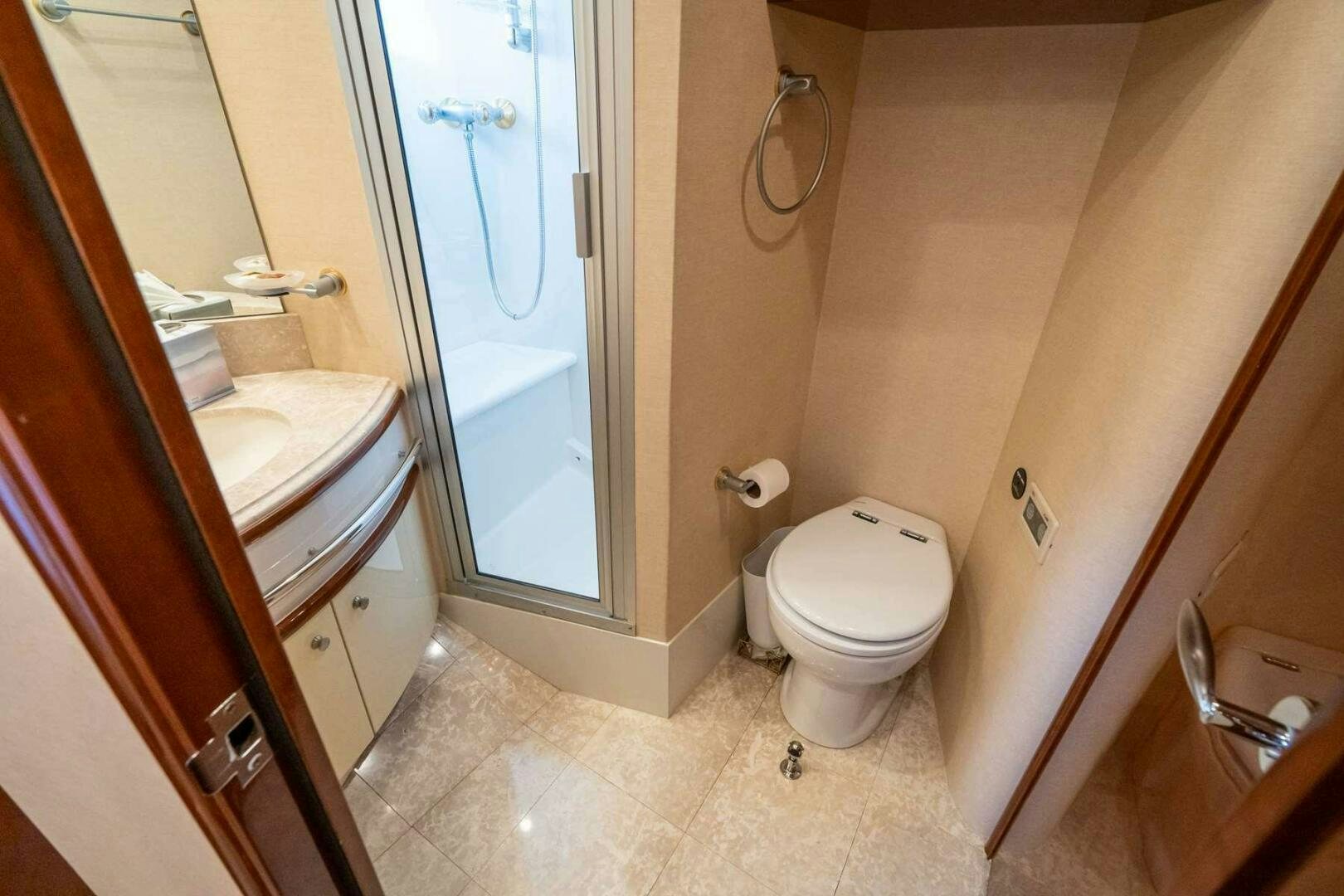 a bathroom with a toilet and sink aboard NAVETTE Yacht for Sale