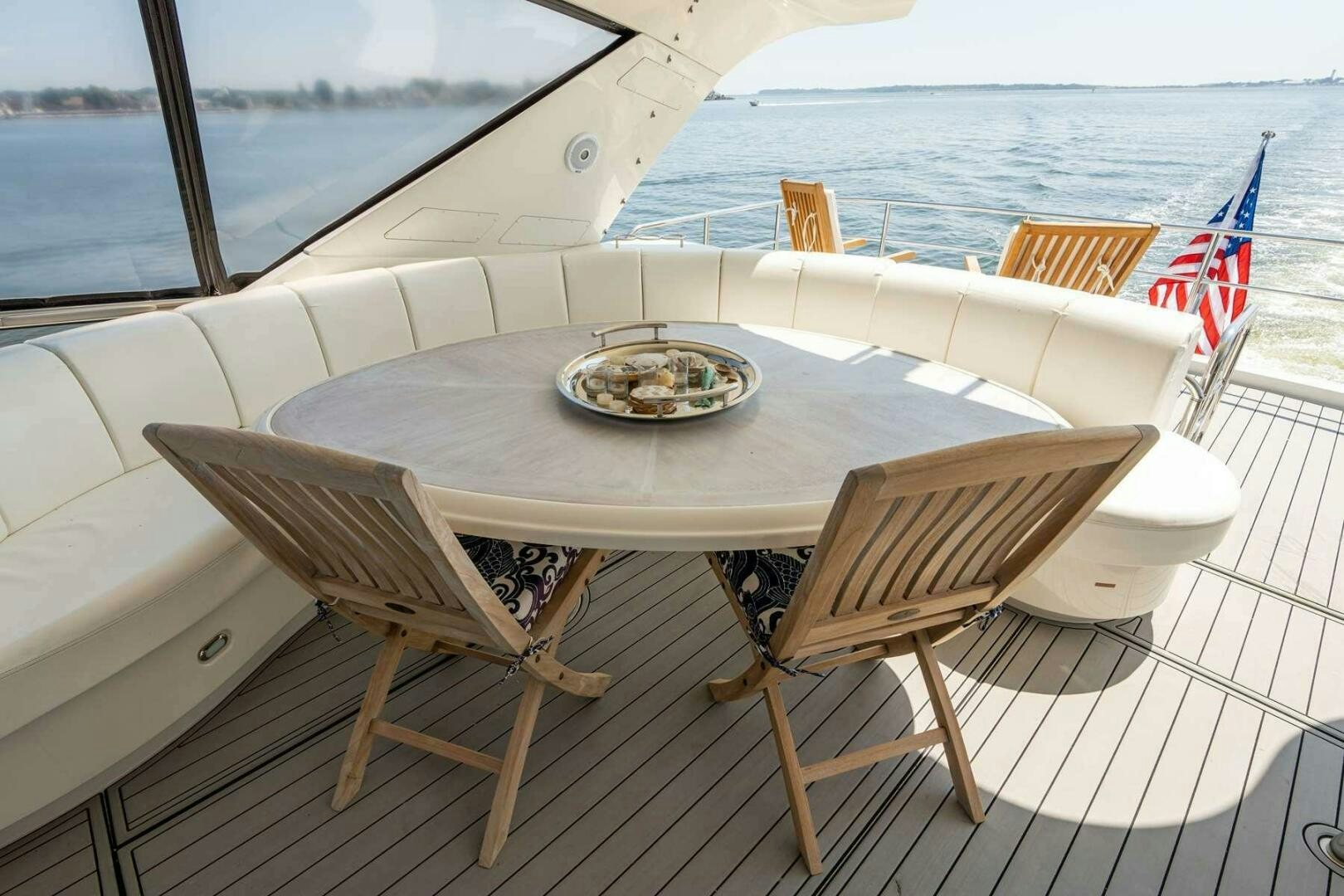 a table on a deck aboard NAVETTE Yacht for Sale