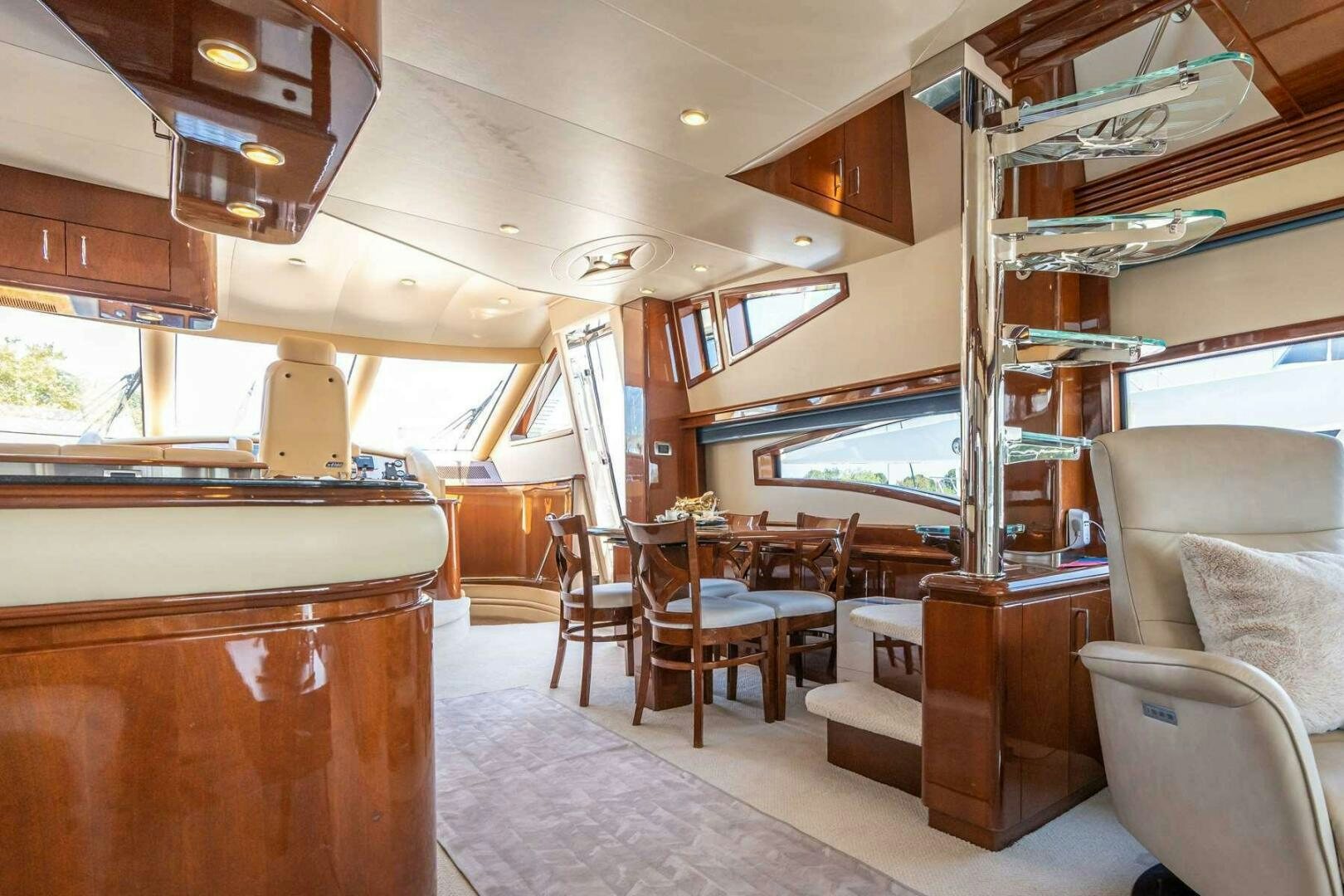 a cabin with a wood table and chairs aboard NAVETTE Yacht for Sale