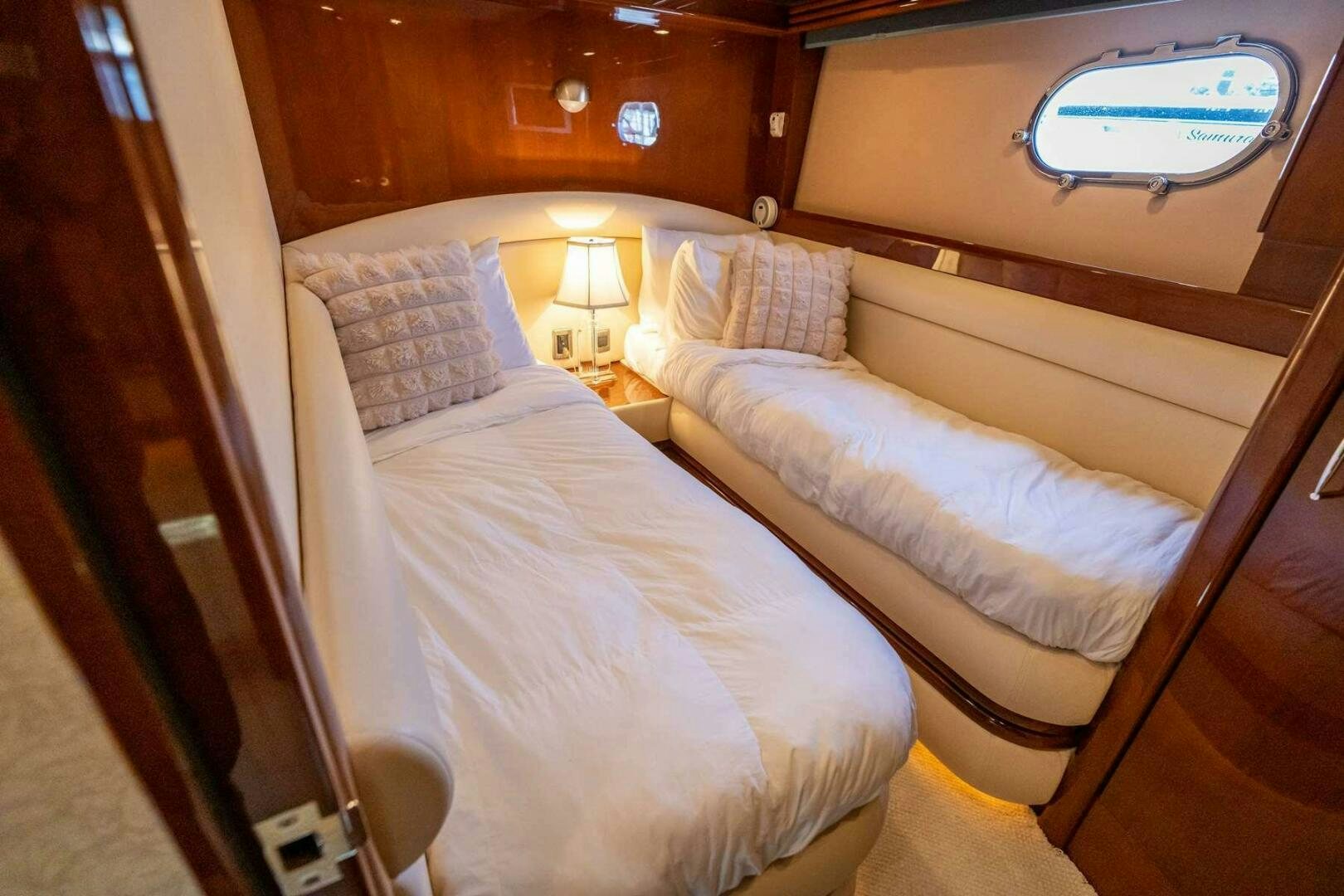 a couple of beds in a room aboard NAVETTE Yacht for Sale