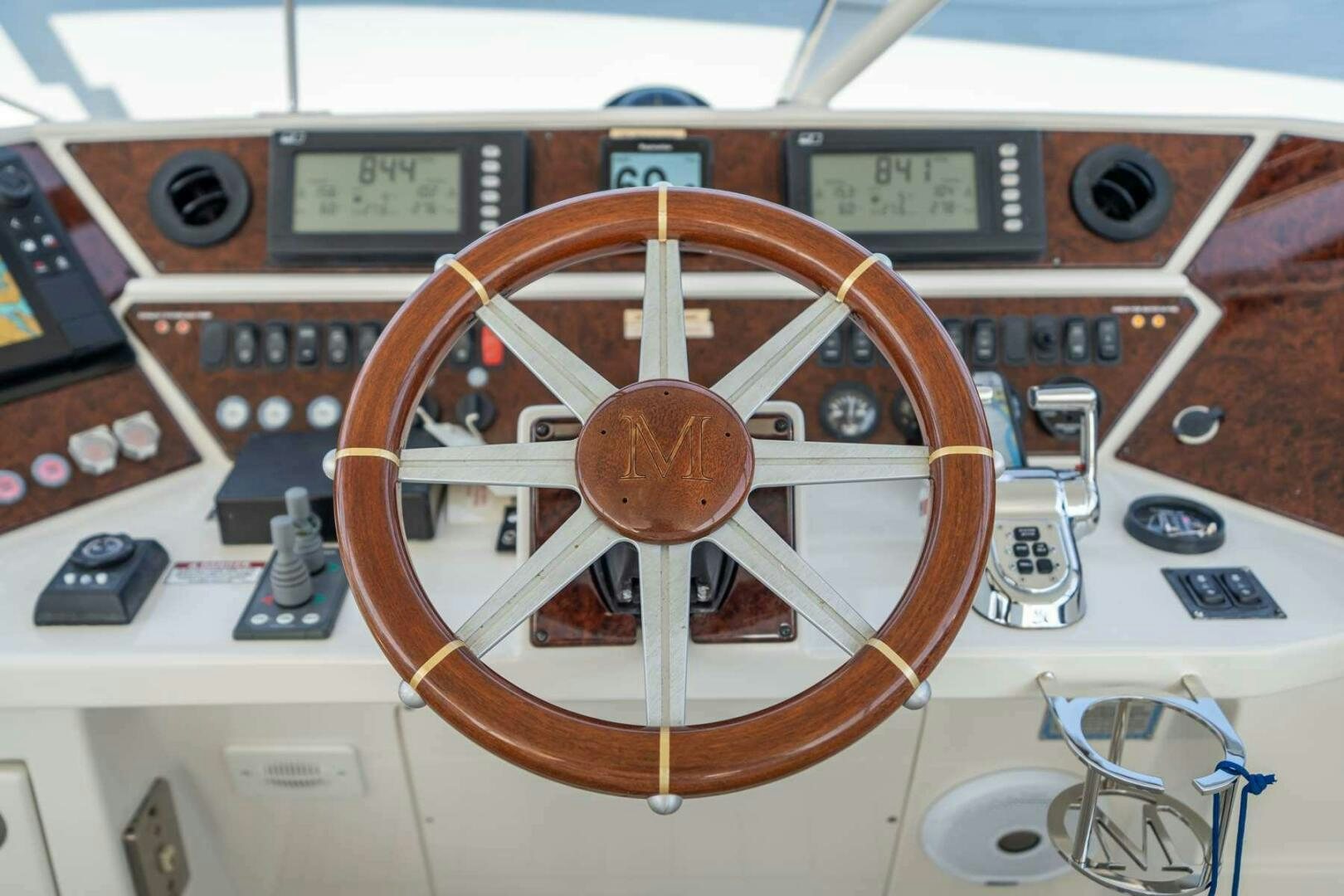 a wooden board with dials and buttons aboard NAVETTE Yacht for Sale