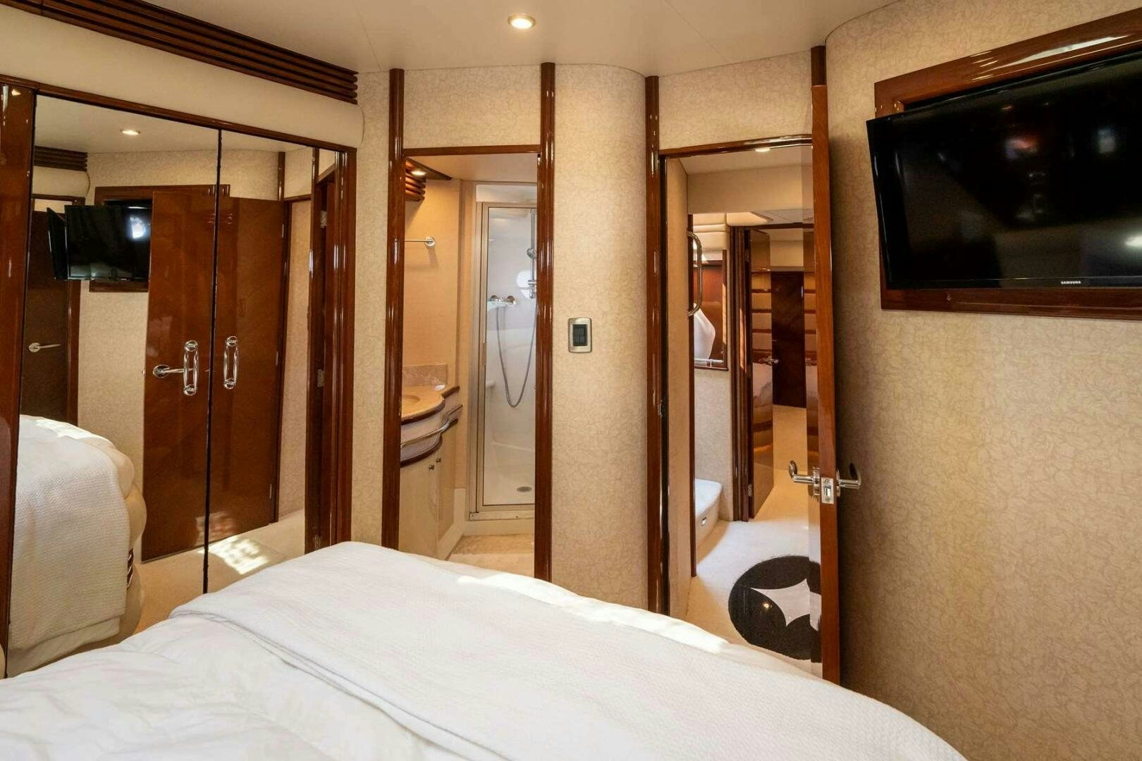 a hotel room with a bed and a television aboard NAVETTE Yacht for Sale