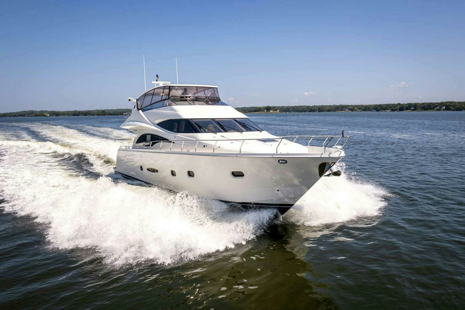 a white boat on water aboard NAVETTE Yacht for Sale
