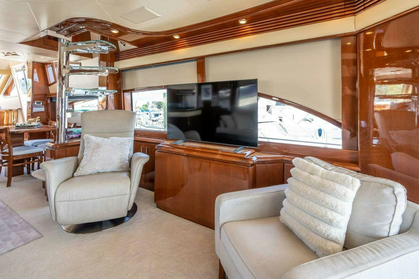 a living room with a couch and a tv aboard NAVETTE Yacht for Sale