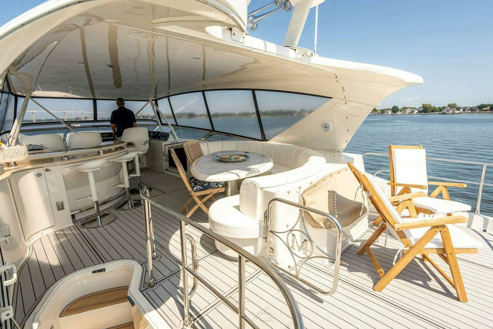 a boat with chairs on the deck aboard NAVETTE Yacht for Sale