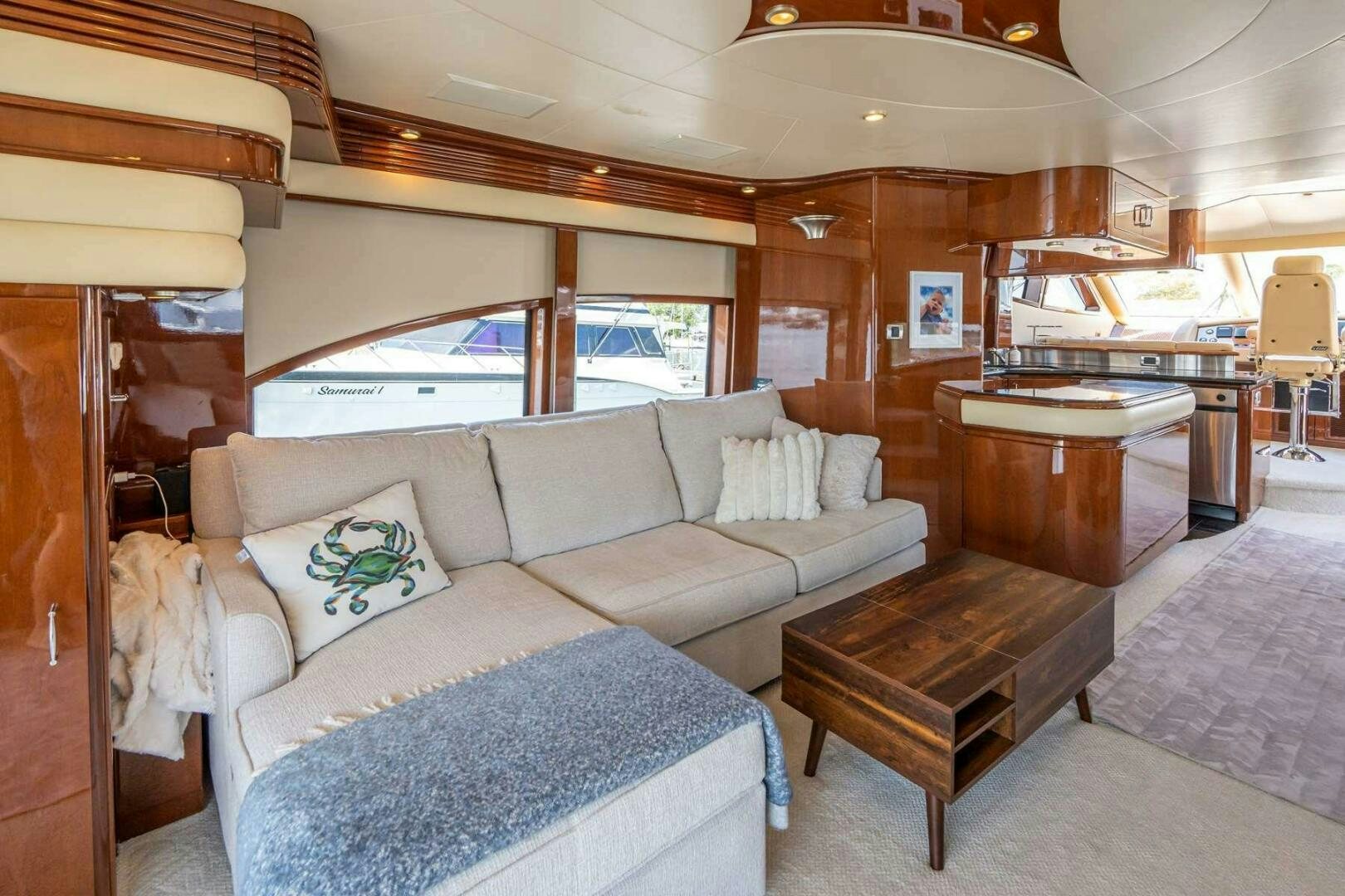 a living room with a couch and a table aboard NAVETTE Yacht for Sale