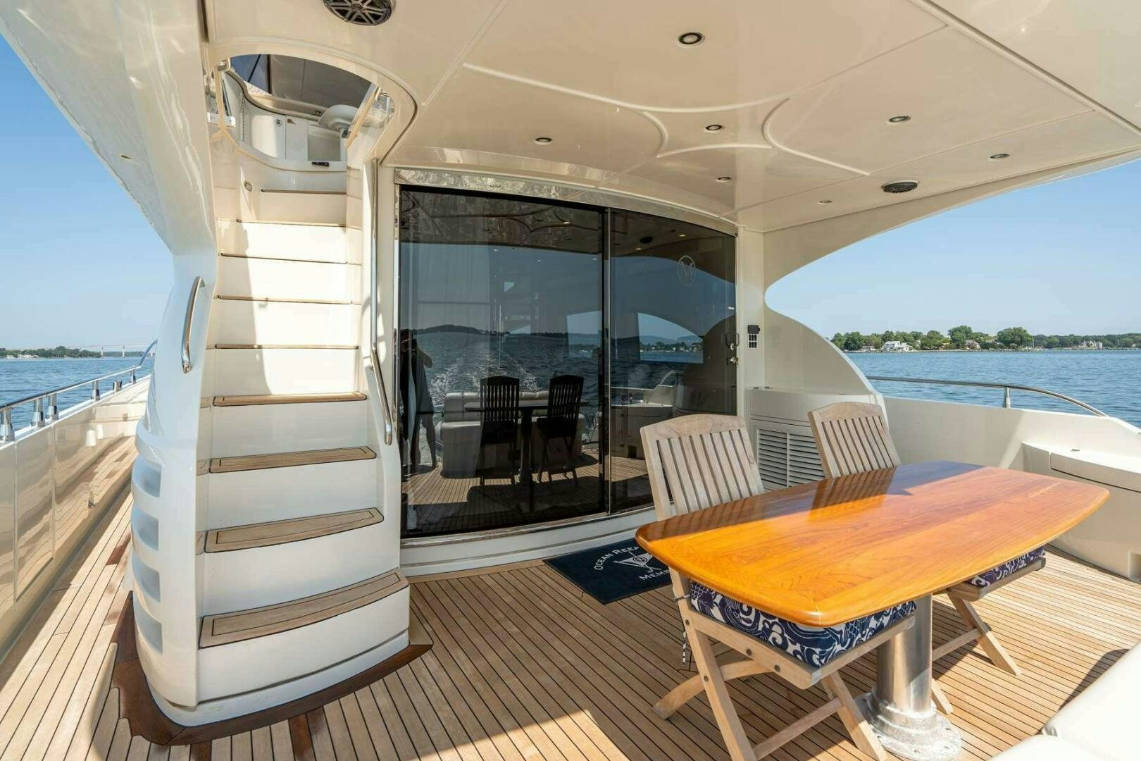 a boat with a table and chairs aboard NAVETTE Yacht for Sale